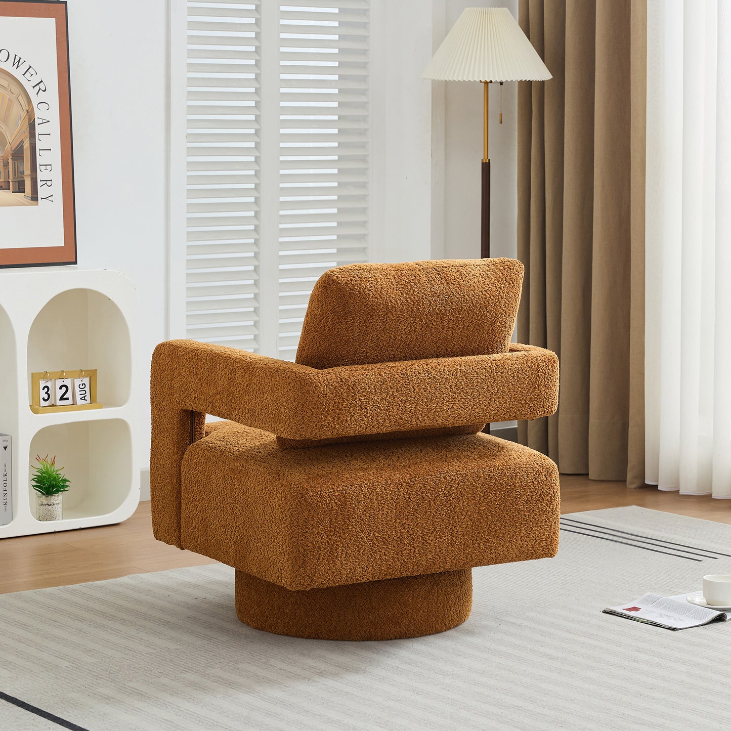 Plush orange boucle swivel accent chair with a modern geometric design