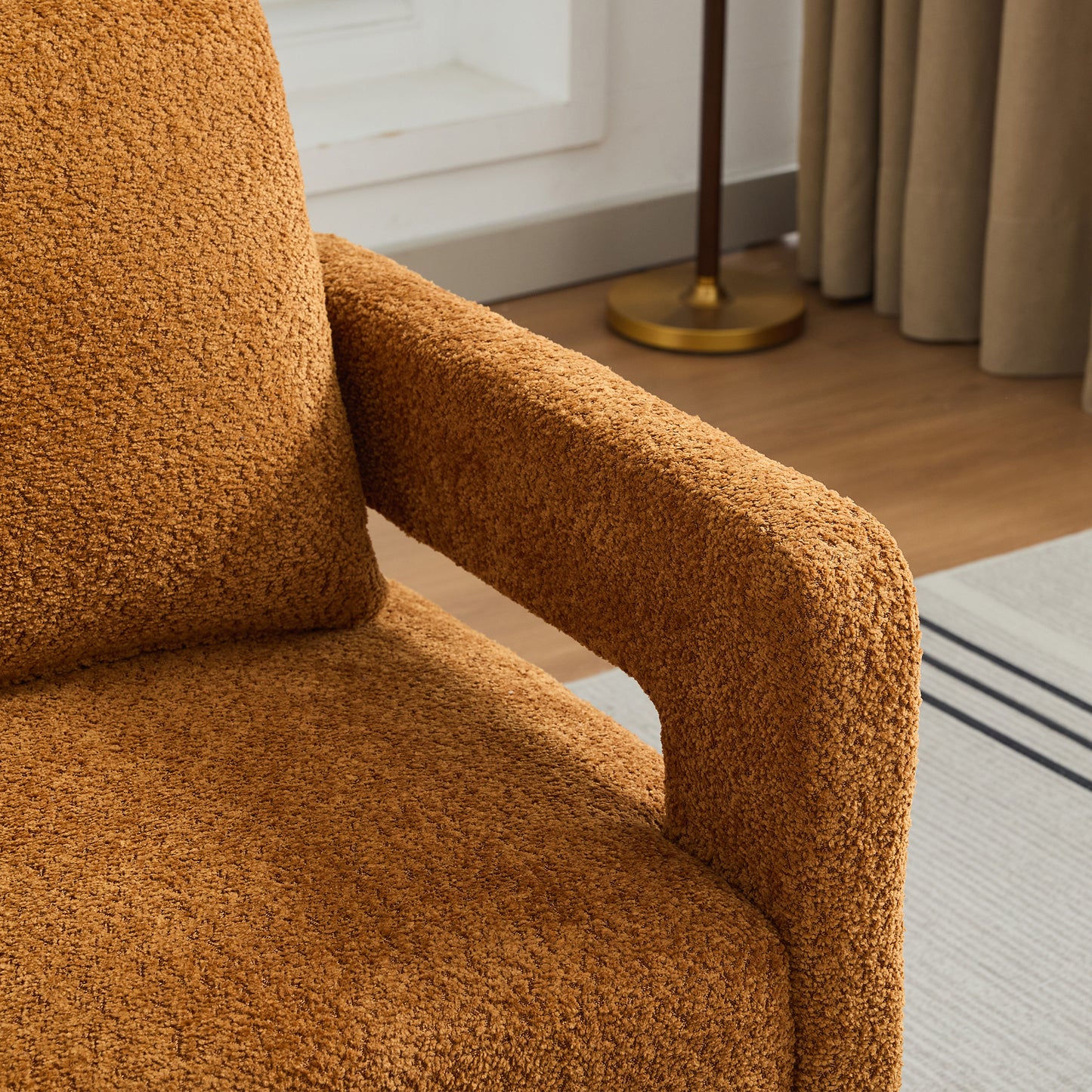 Cozy caramel teddy bear fabric armchair armrest detail
