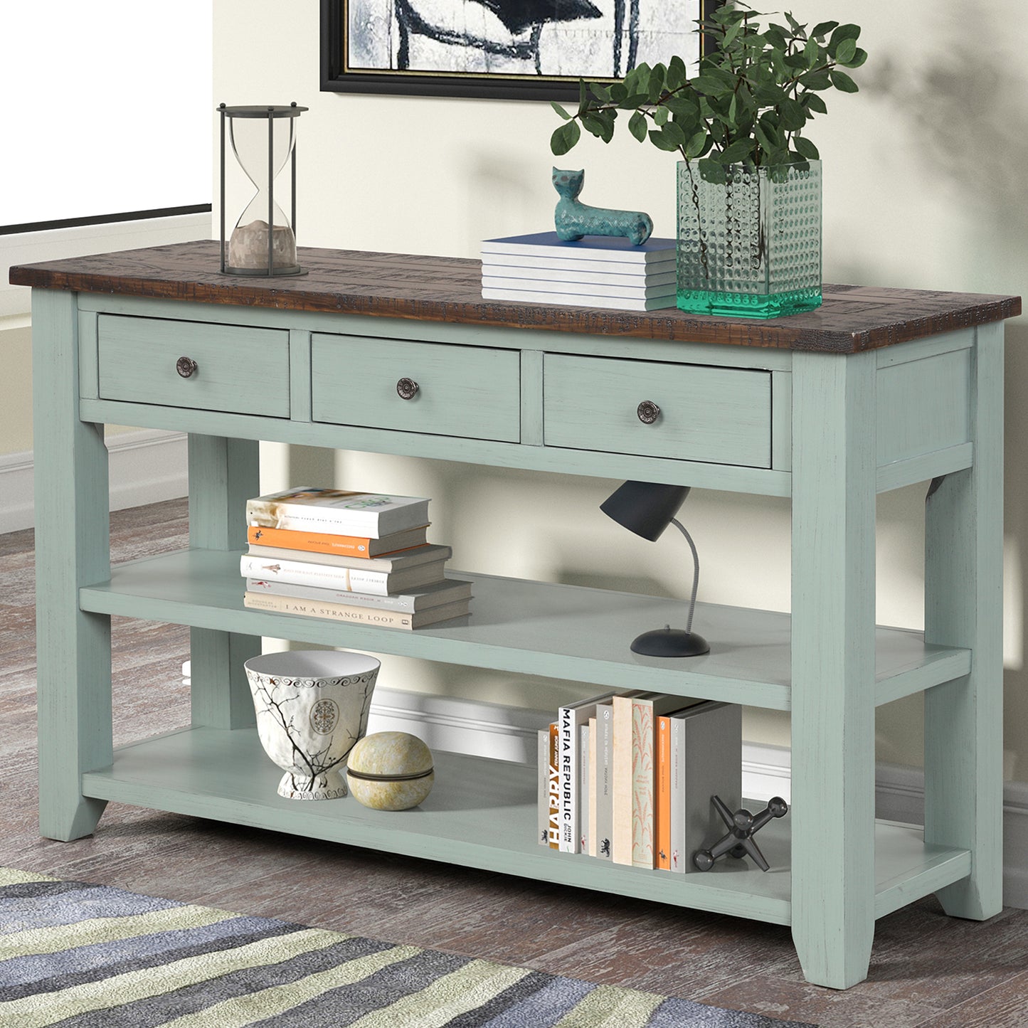 Distressed blue wood console table with three drawers and open shelves perfect for entryways