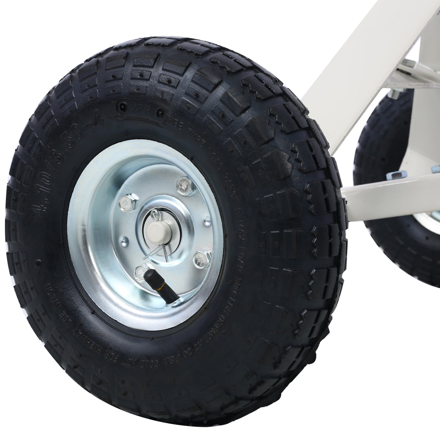 Black pneumatic tire with silver rim part of a heavy duty wagon wheel