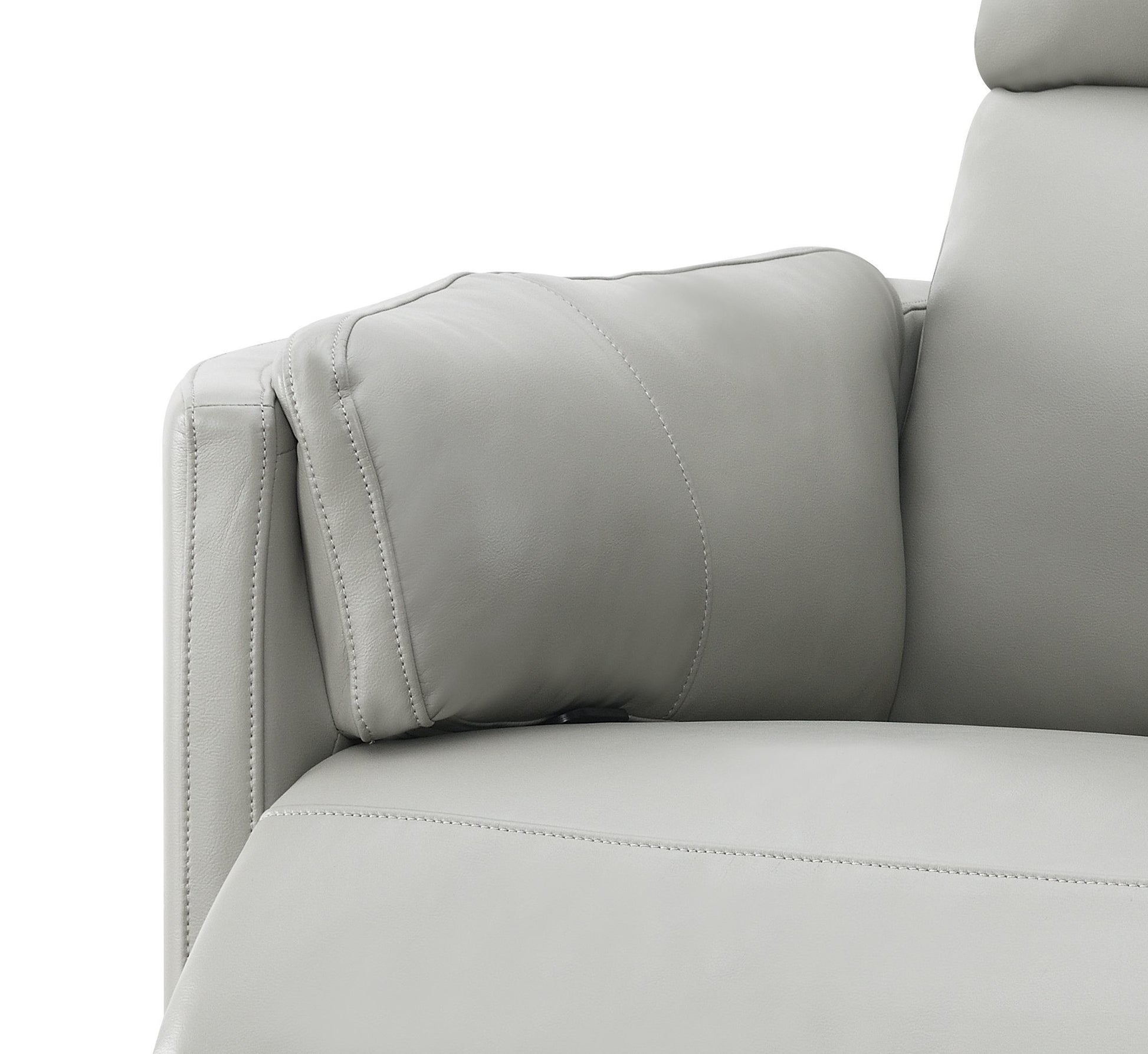 Closeup of a soft grey leather recliner armrest with detailed stitching