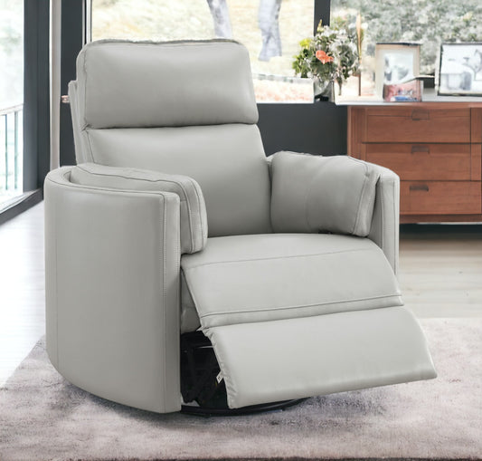 Light gray leather recliner with padded headrest and footrest extended