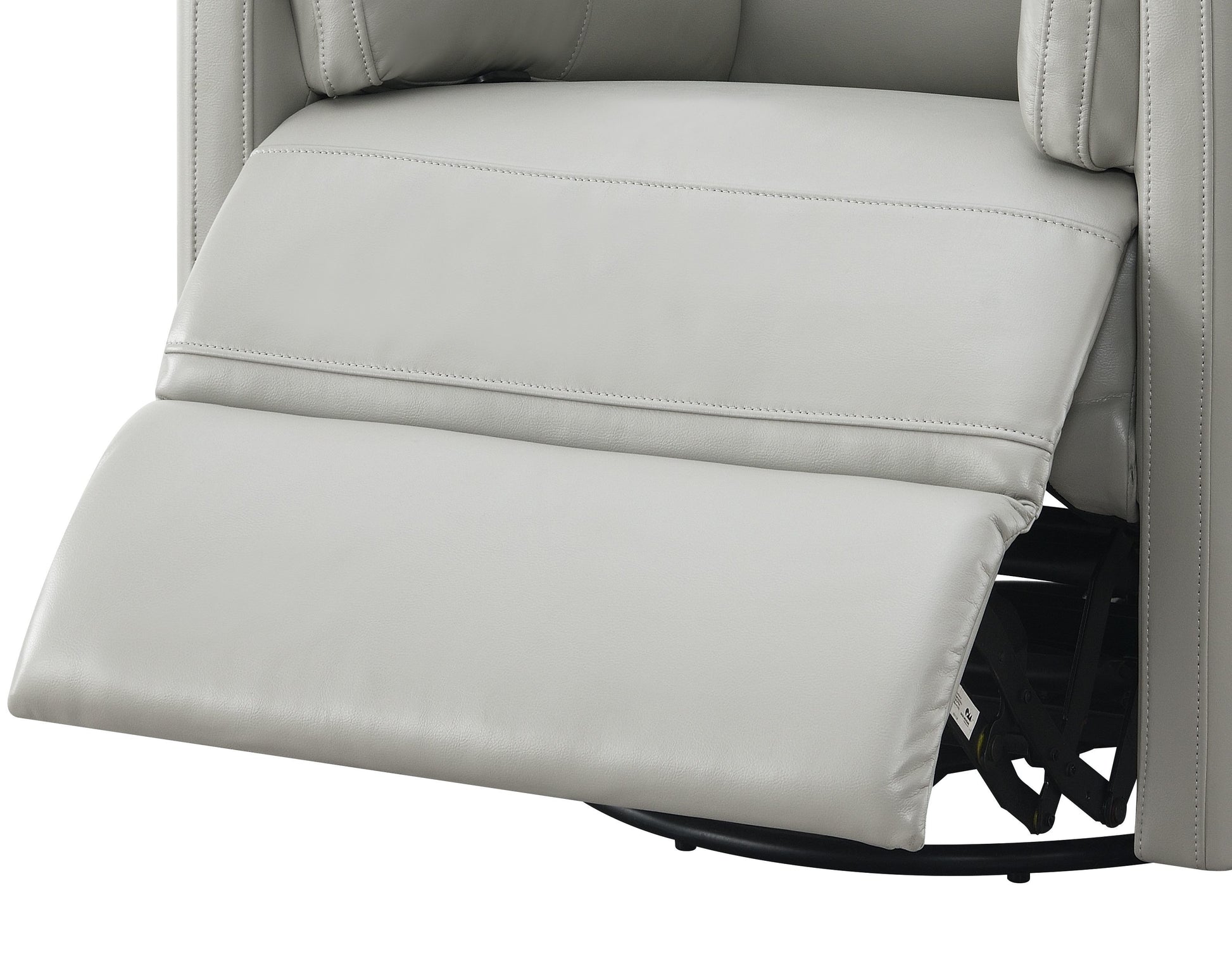 Closeup of a light gray leather recliner with padded footrest extended showing stitching detail