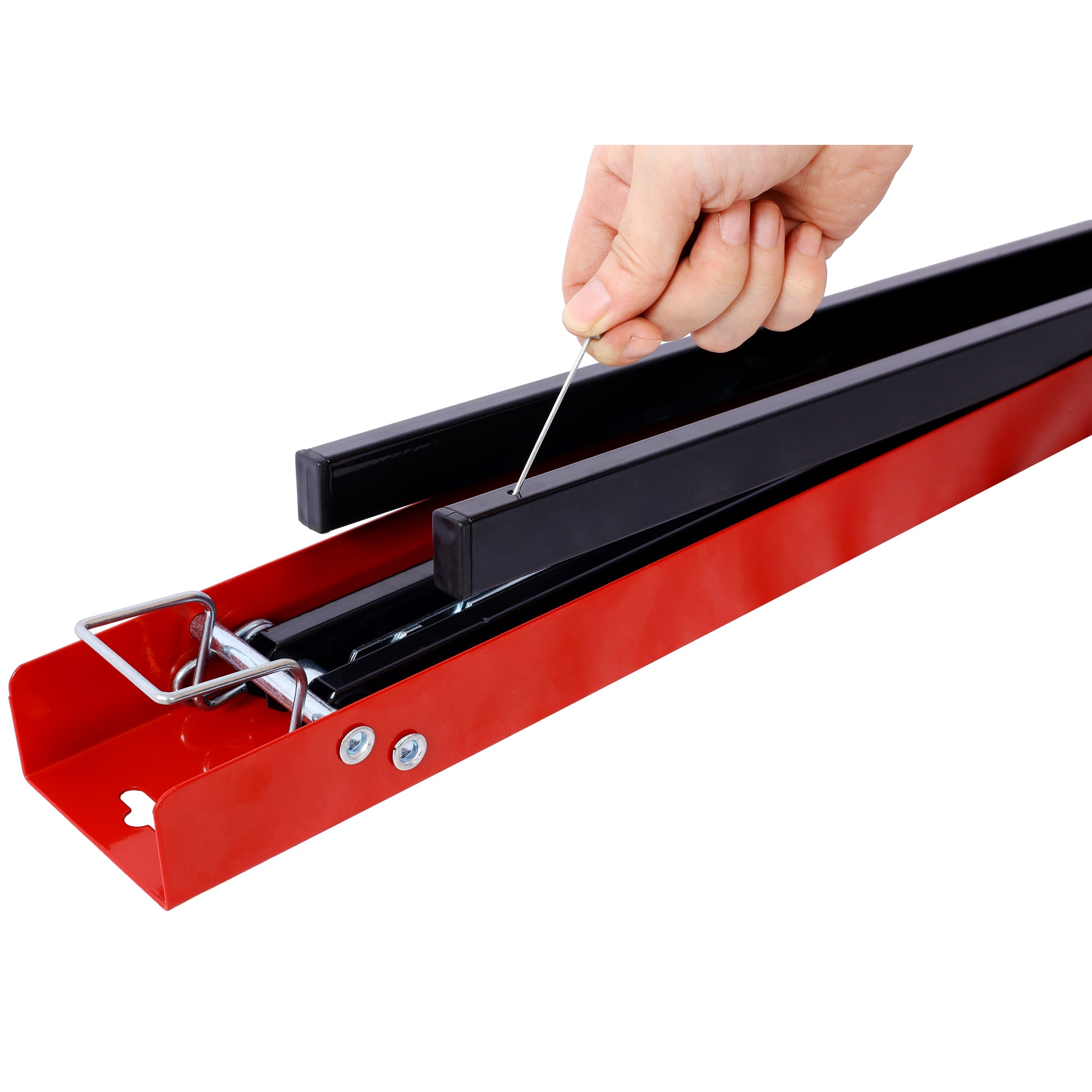 Red steel frame with black adjustable supports and a hand inserting a pin