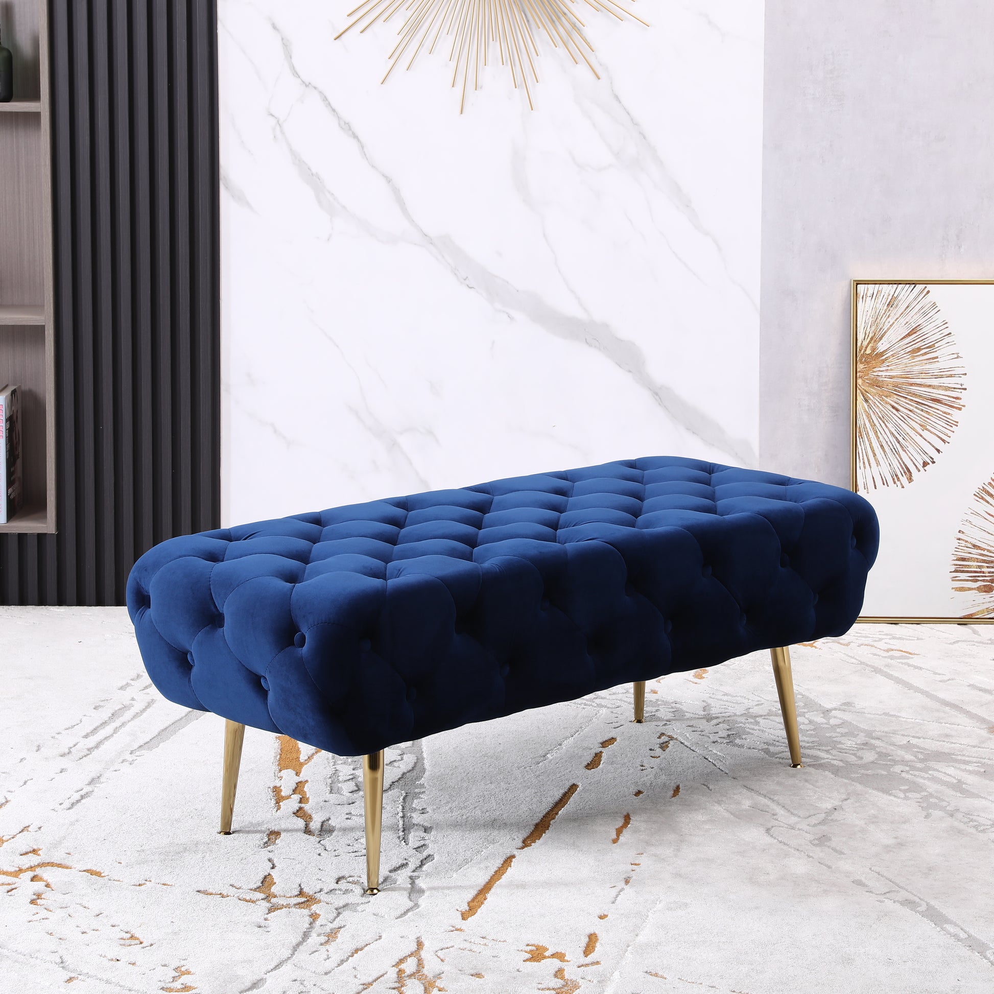 Deep blue velvet tufted bench with gold metal legs for entryway seating