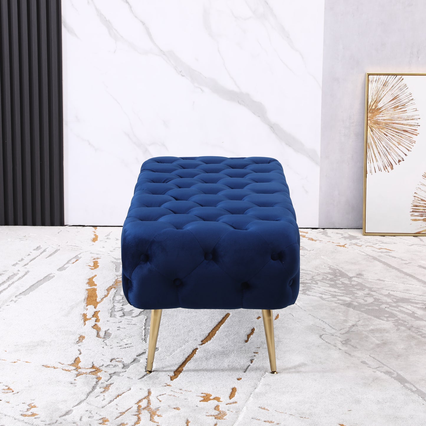 Deep blue velvet tufted ottoman with gold legs