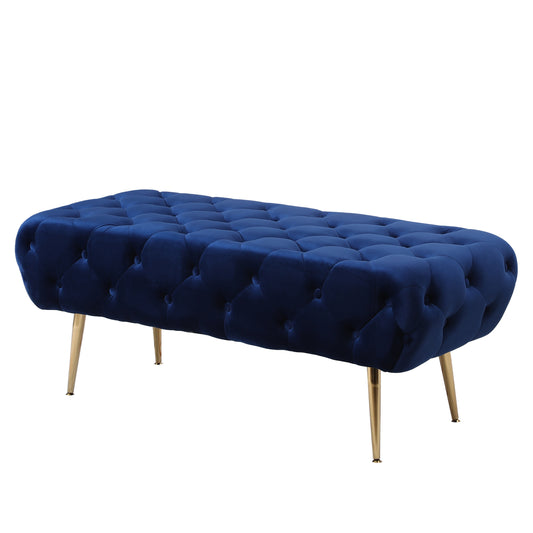 Deep blue velvet tufted ottoman with gold tapered legs for entryway bench