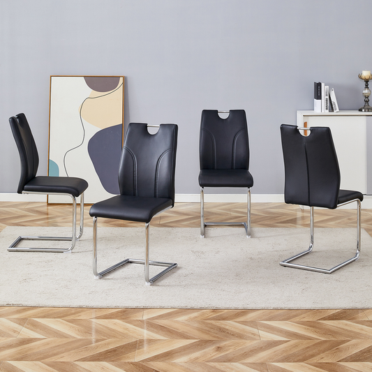 Four black faux leather dining chairs with chrome cantilever legs