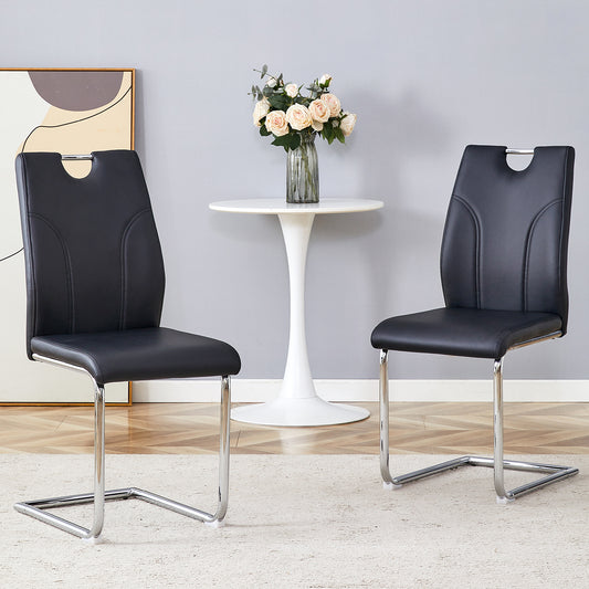 Two black faux leather dining chairs with chrome cantilever bases modern design
