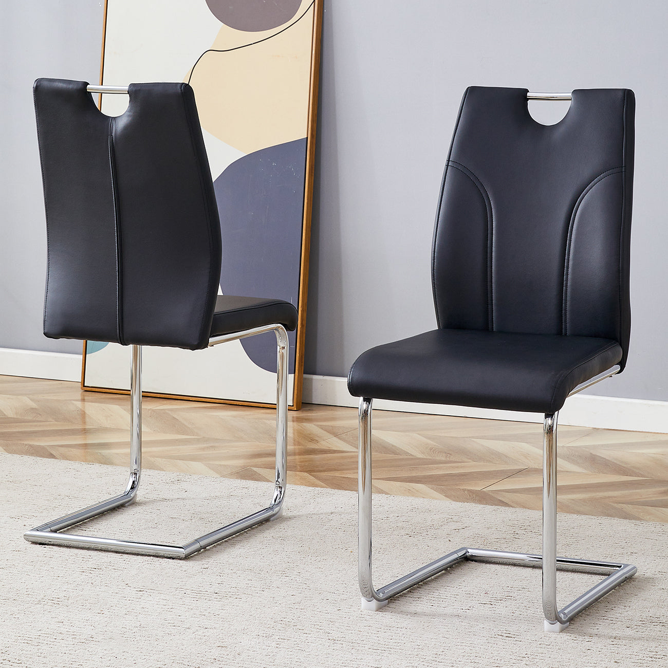 Black faux leather cantilever dining chair with modern chrome base