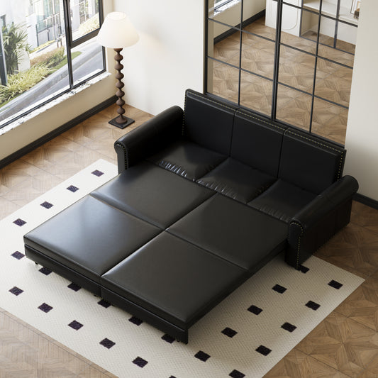 Black leather sofa bed with brass nailhead trim and tufted back cushions