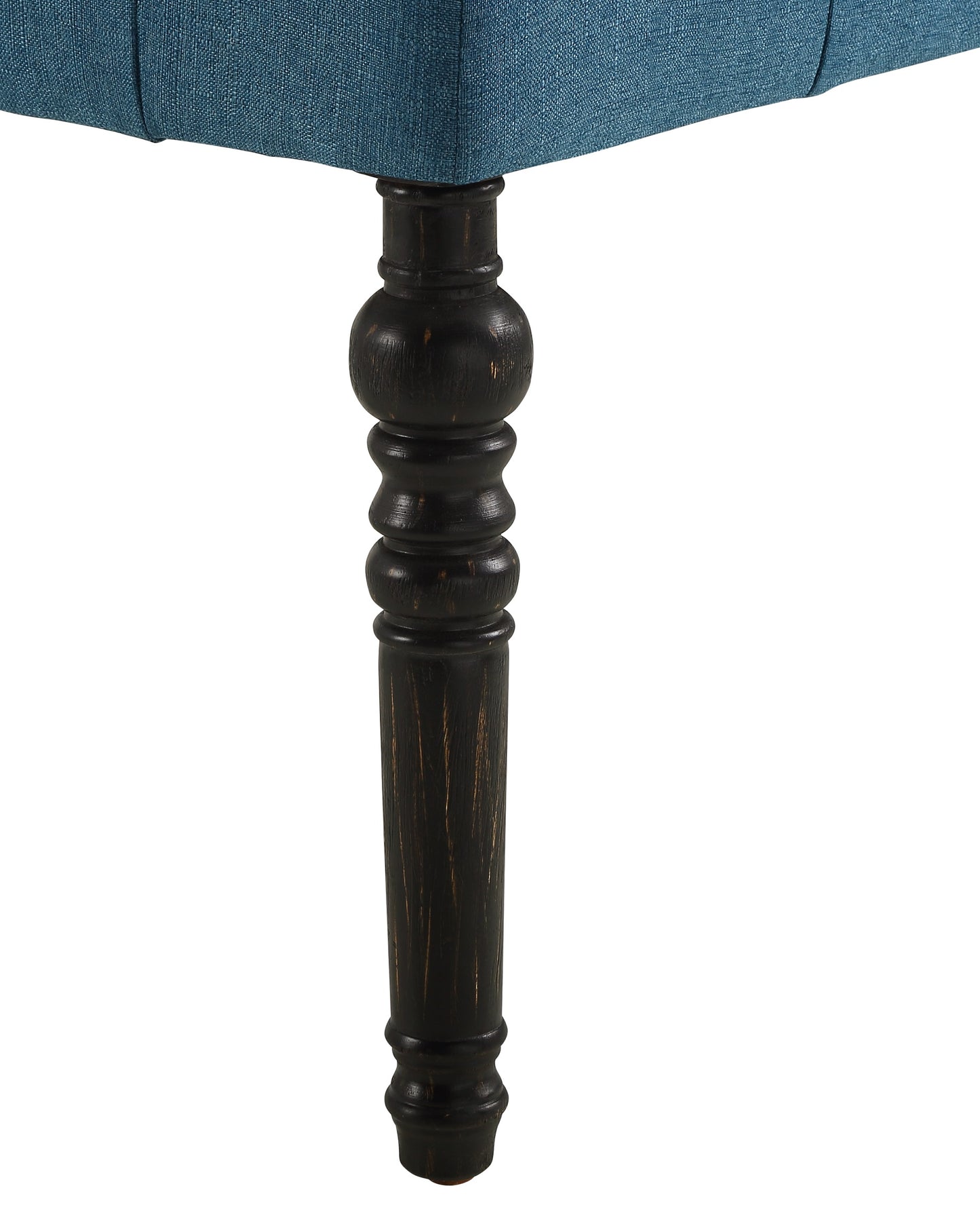 Teal upholstered armchair with carved dark wood leg