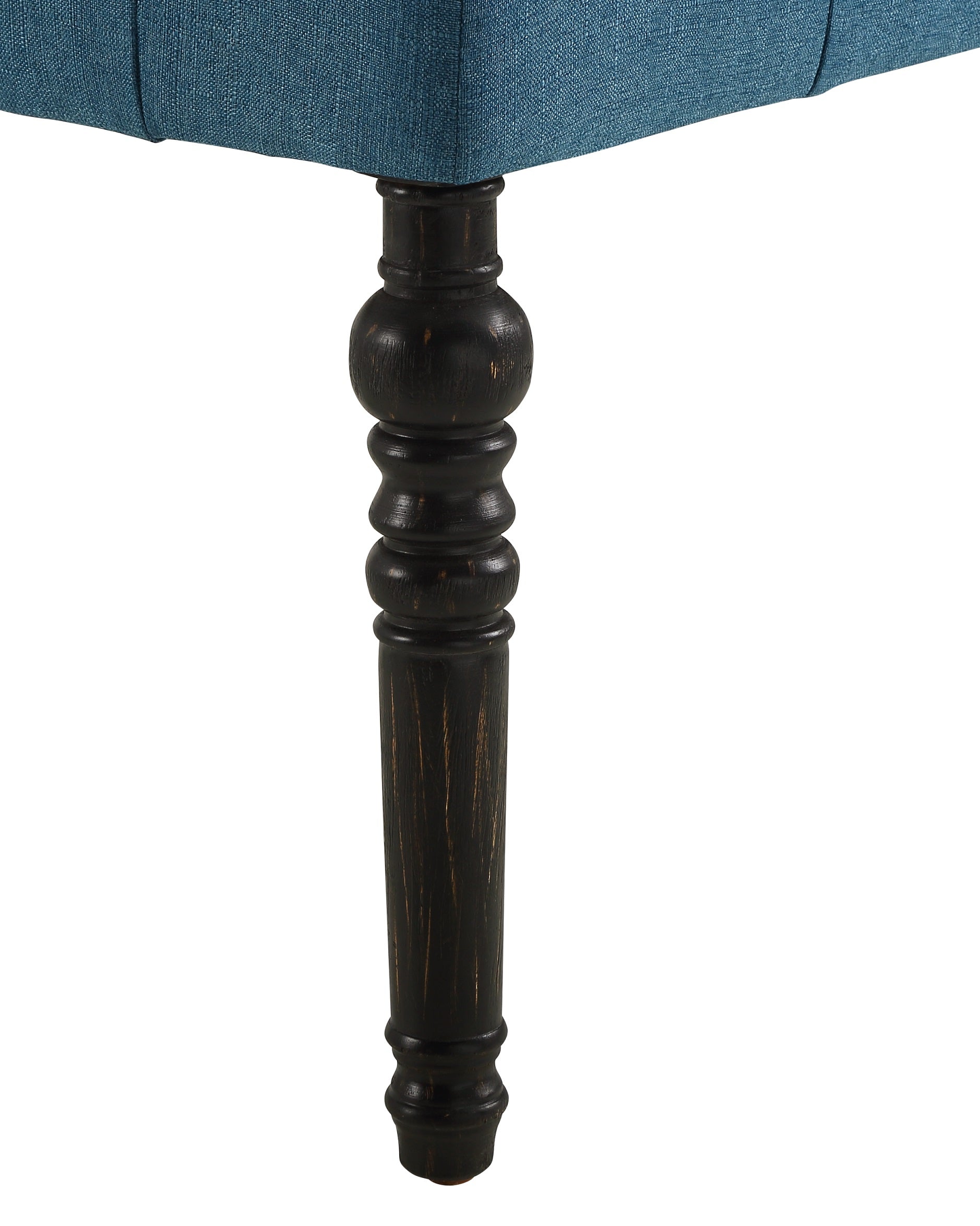 Teal upholstered armchair with carved dark wood leg