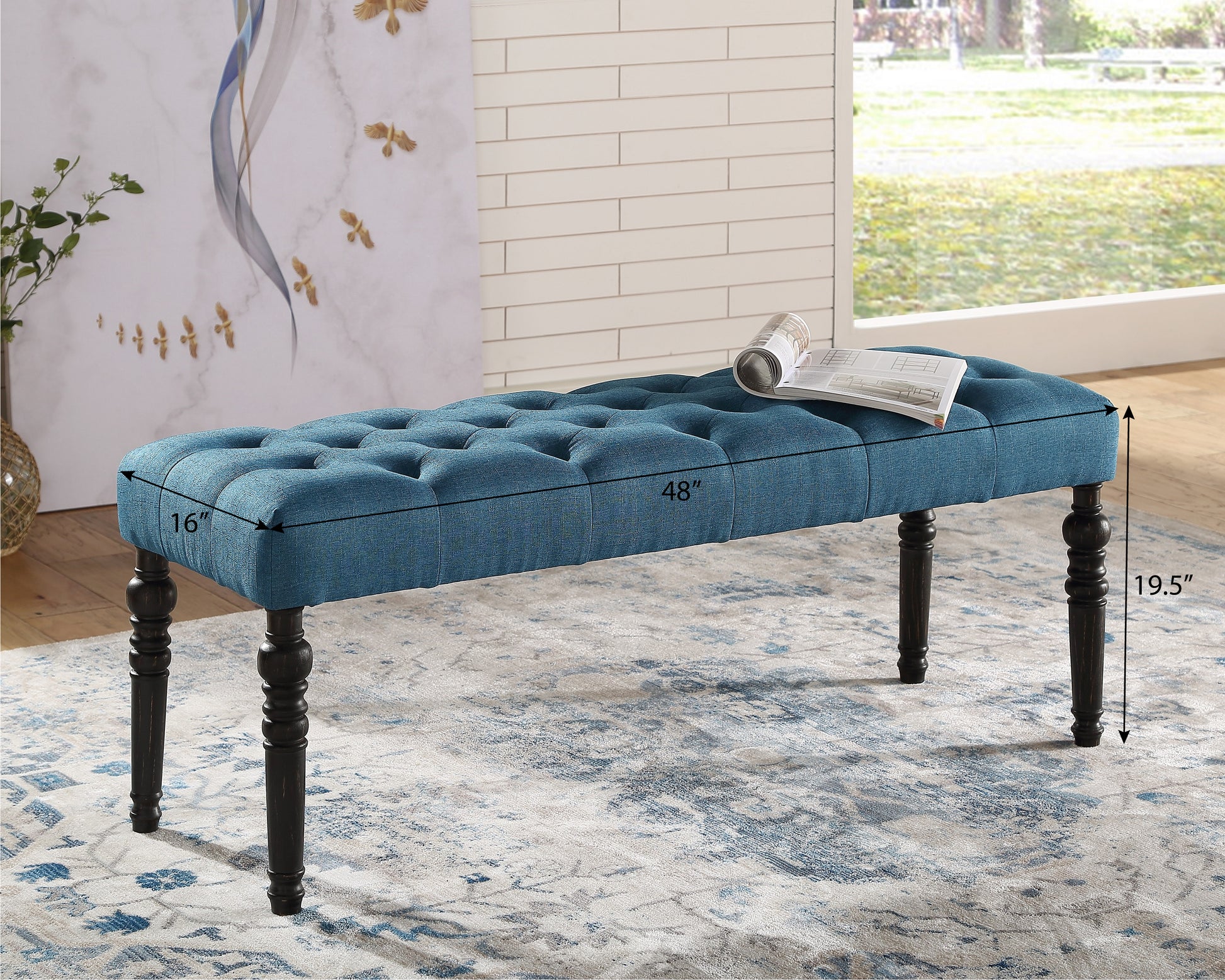 Tufted navy blue linen bench with carved dark wood legs perfect for entryway seating