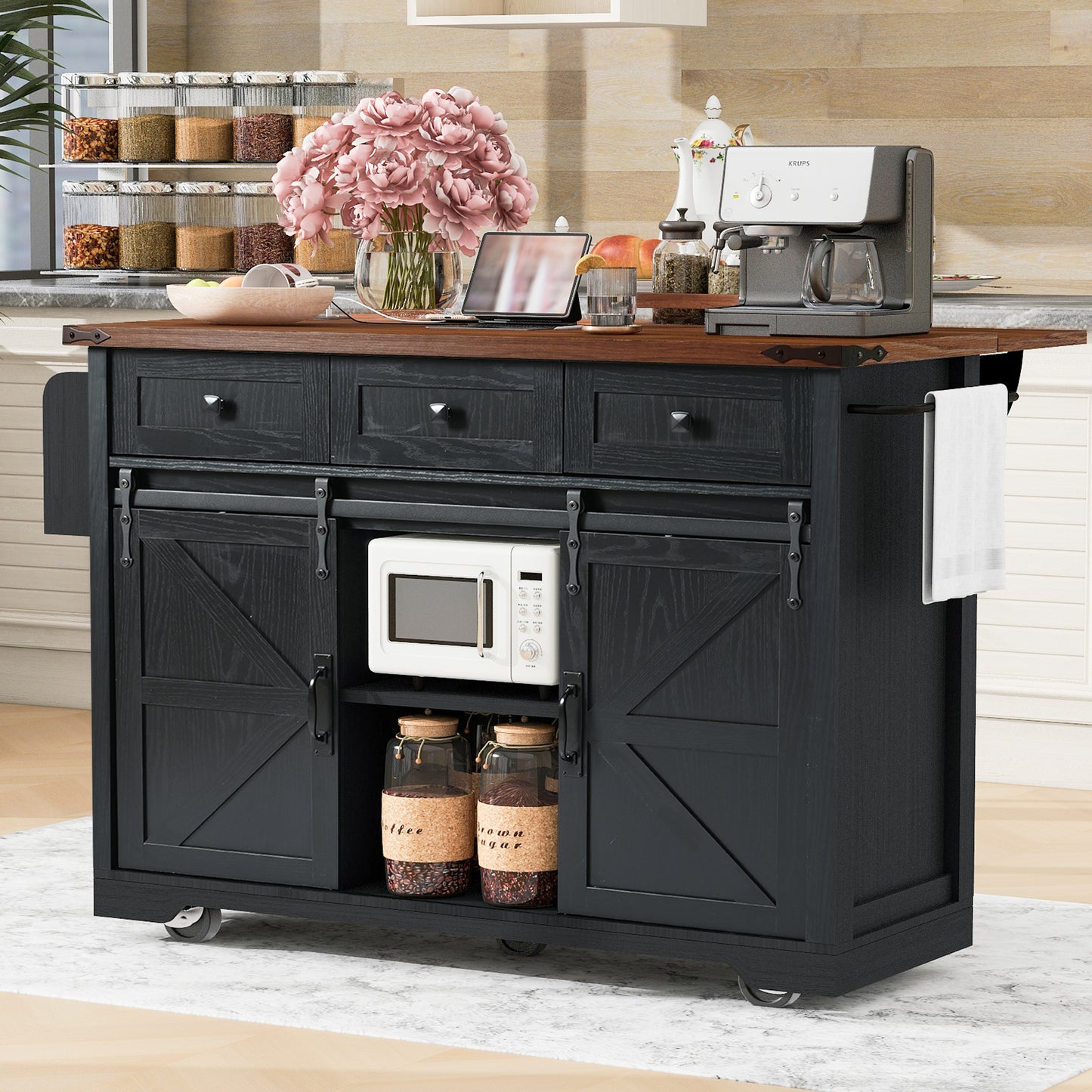 Black kitchen island with sliding barn doors drawers and storage shelves for microwave