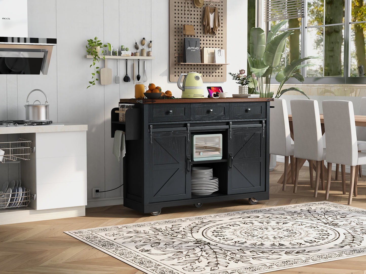 Black wooden kitchen island with barn doors and a butcher block top