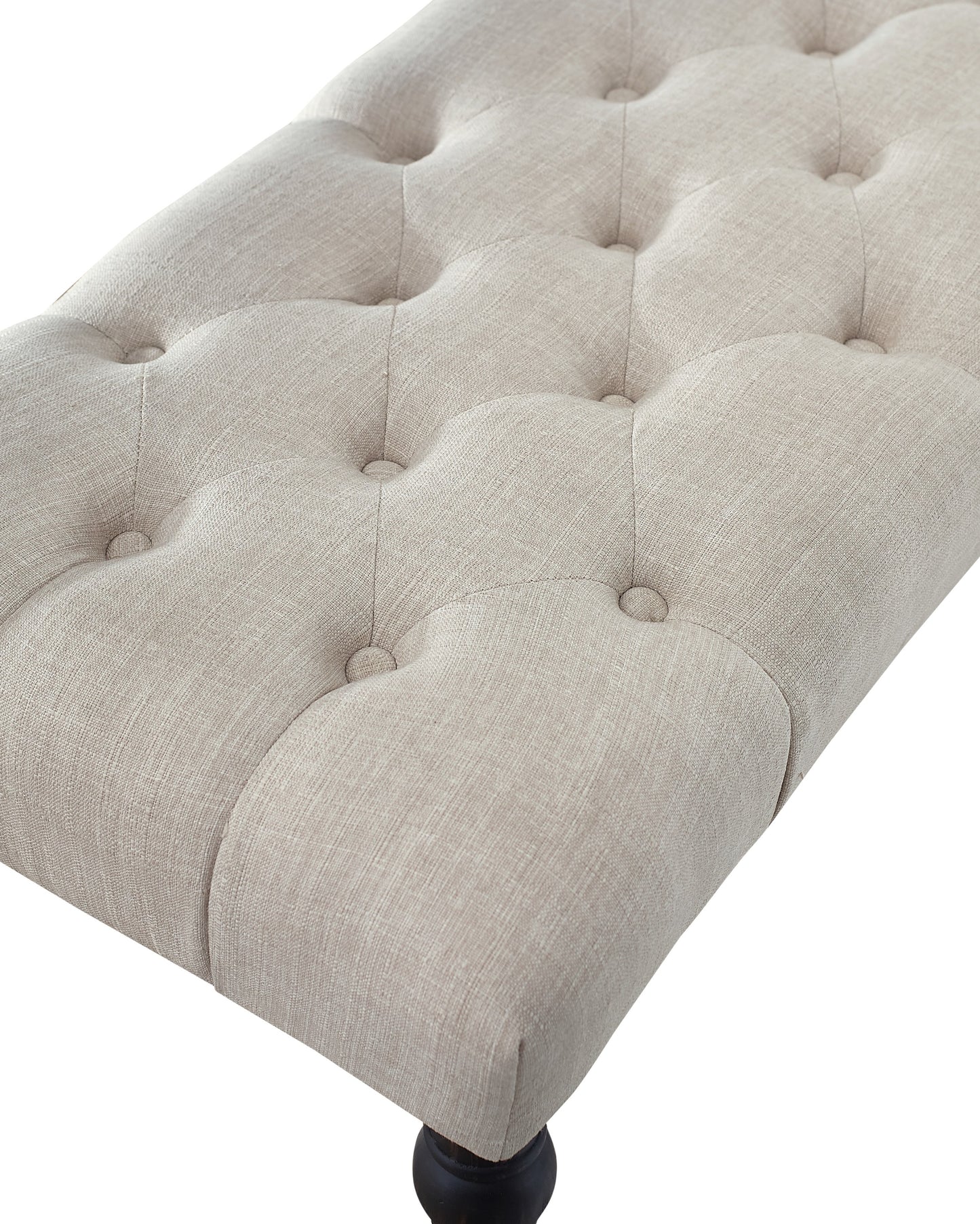 Cream linen tufted ottoman with dark wood leg