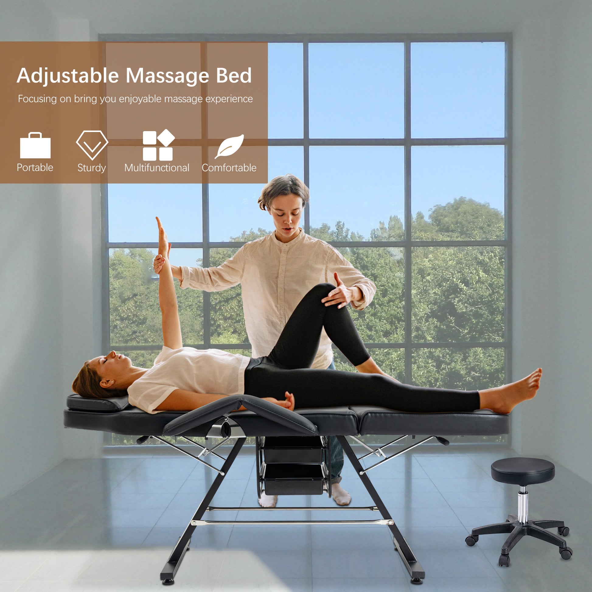 Black adjustable massage bed with therapist working on clients arm