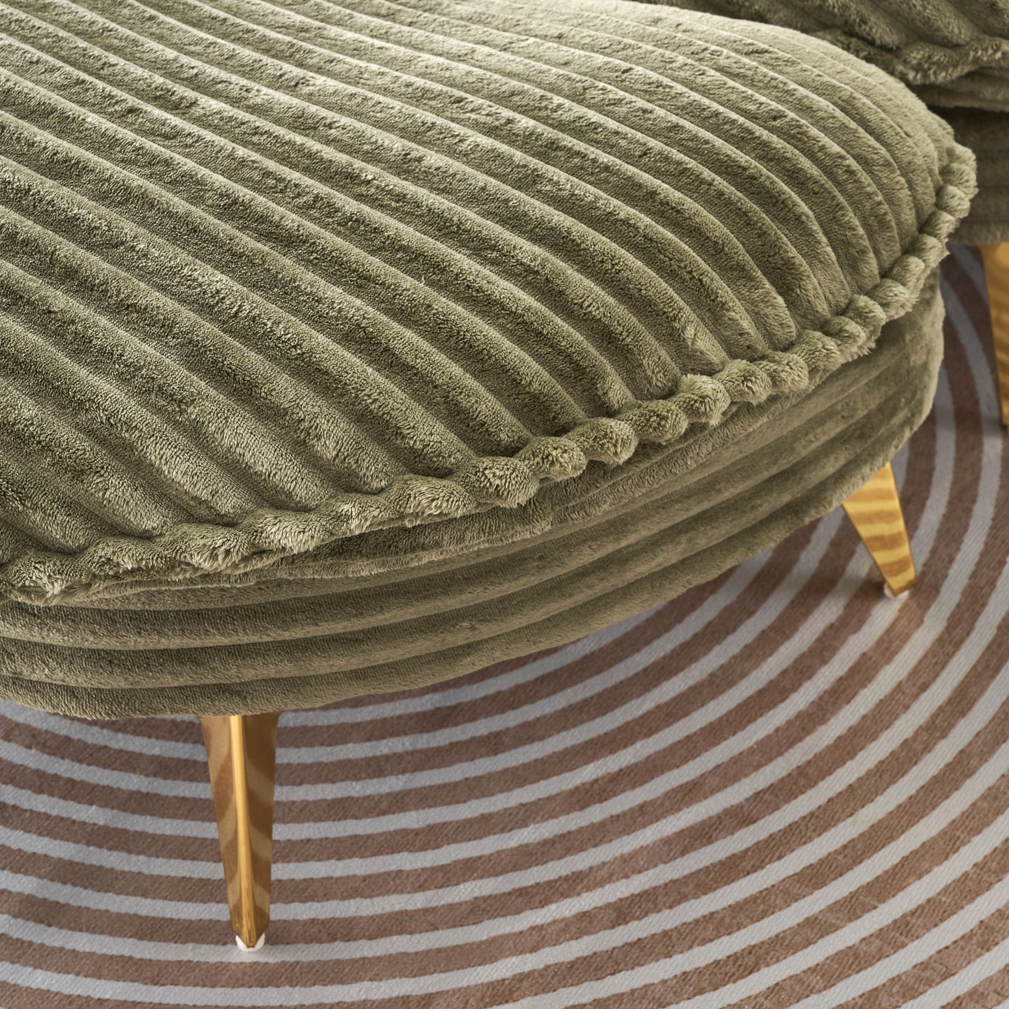 Sage green corduroy ottoman with plush textured fabric and gold tapered legs