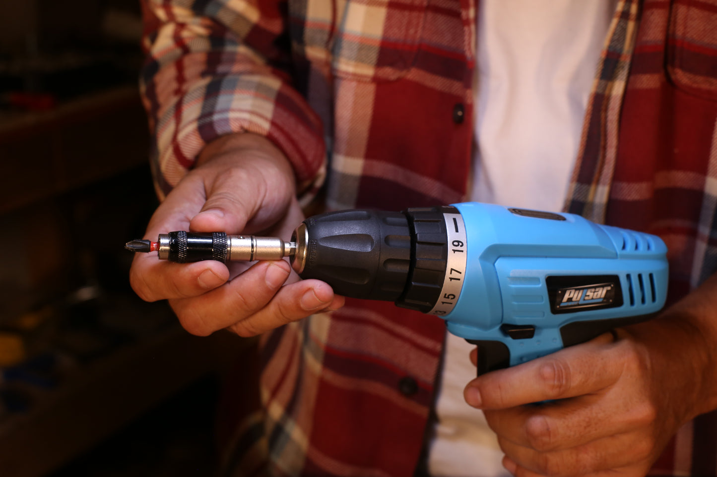 Blue cordless drill with adjustable torque settings and magnetic bit holder