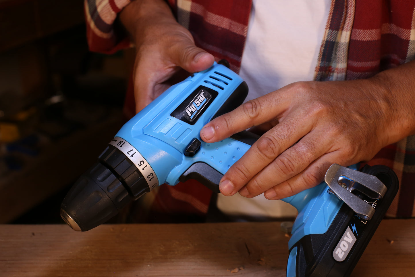 Bright blue cordless drill with black accents featuring a V battery pack for DIY projects