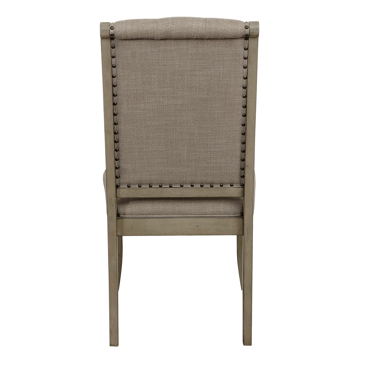 Tufted linen dining chair in a neutral gray fabric with nailhead trim details and a distressed wood frame