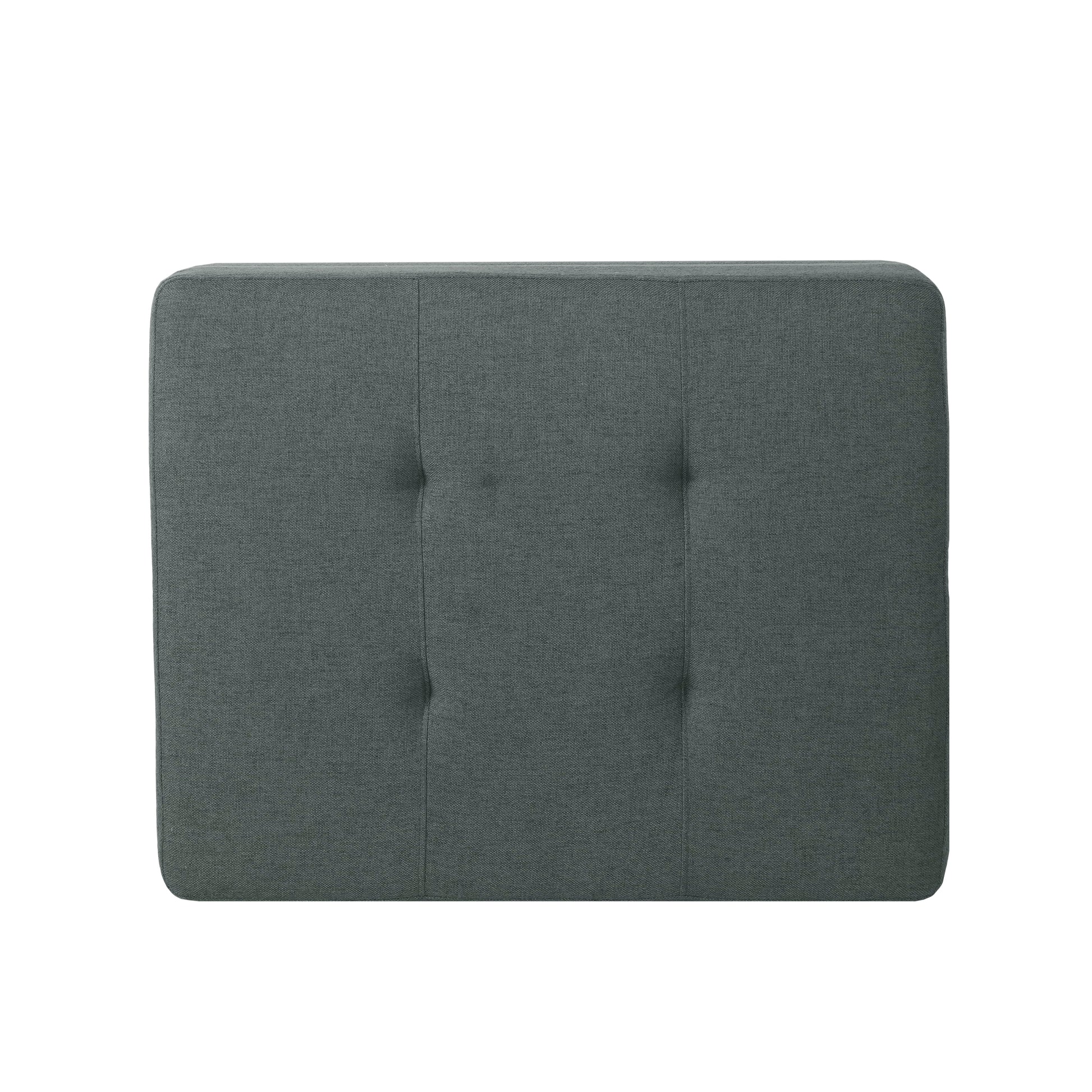 Dark gray upholstered headboard with button tufting and clean stitching