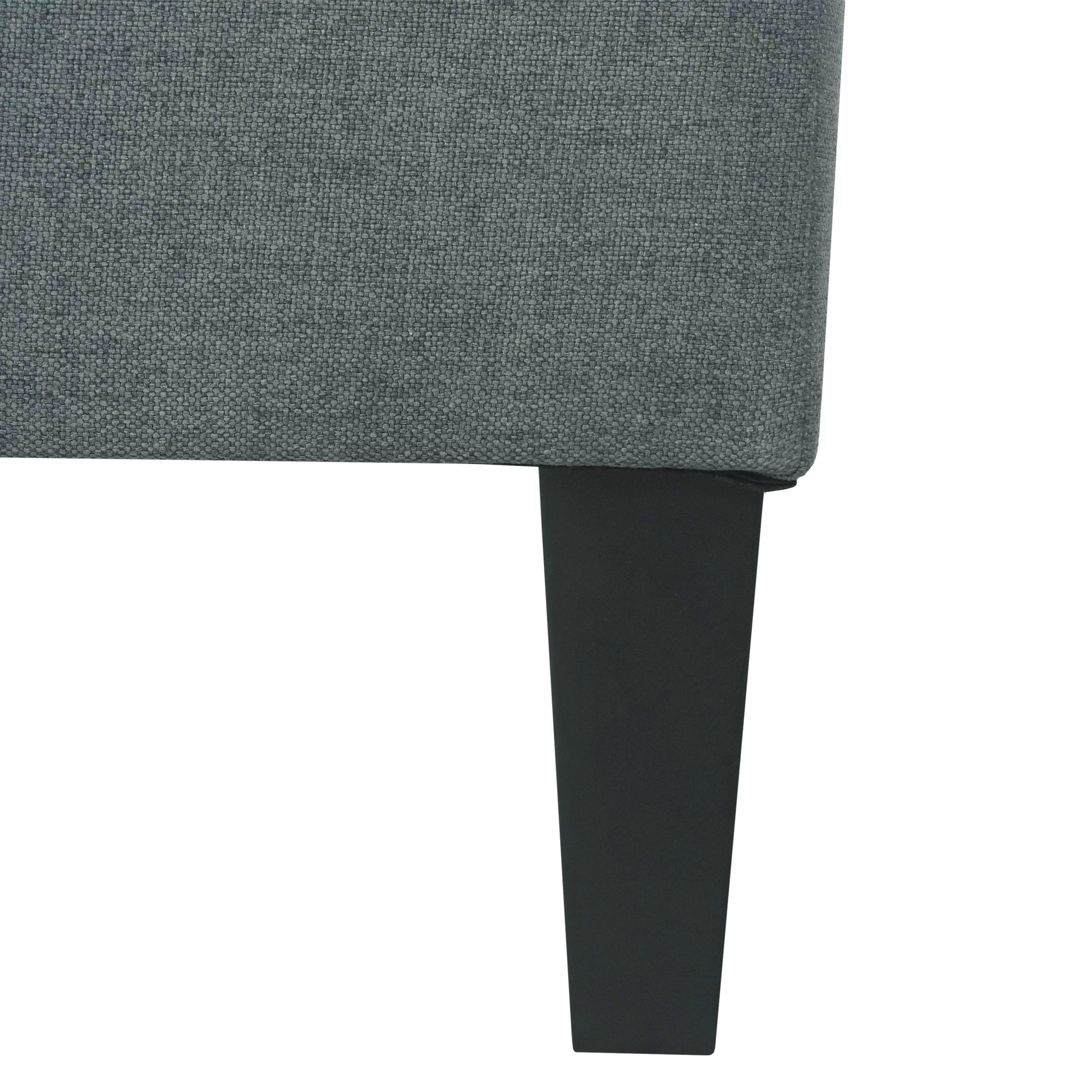 Close up of textured grey upholstery on a modern armchair showing woven fabric