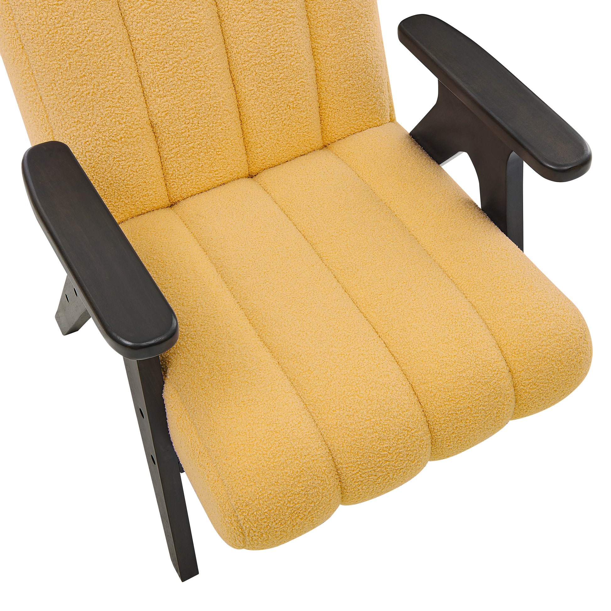 Closeup of a textured yellow boucle fabric accent chair with dark wood arms