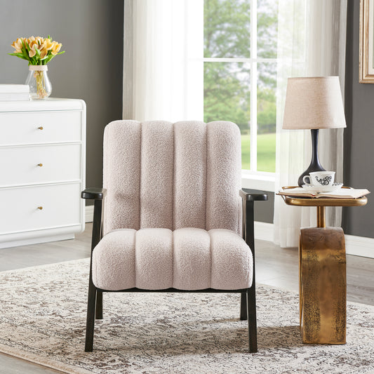 Textured boucle armchair in cream with dark metal frame and ribbed seatback for cozy seating