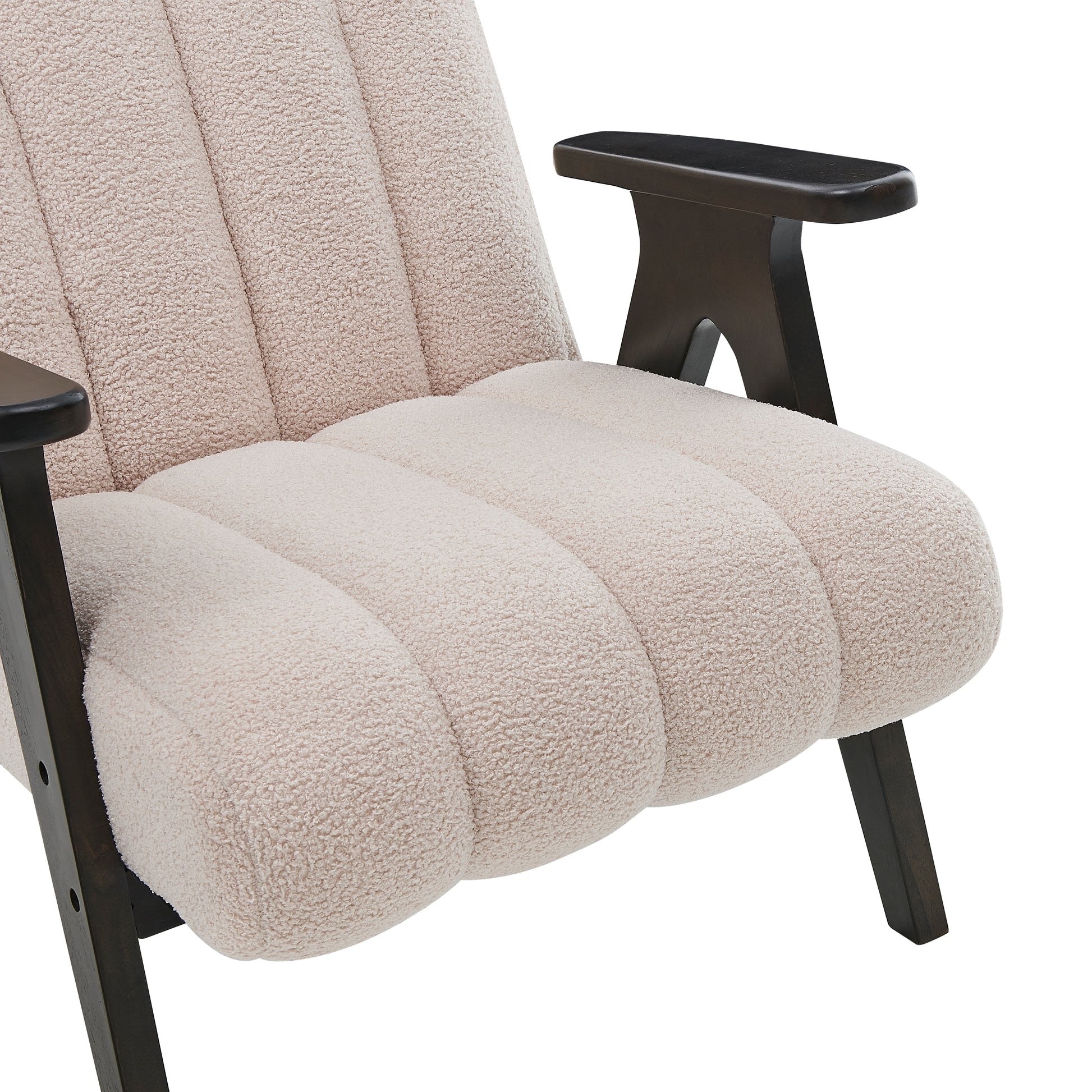 Cream boucle armchair with dark wood armrests and legs plush seating and channel tufting