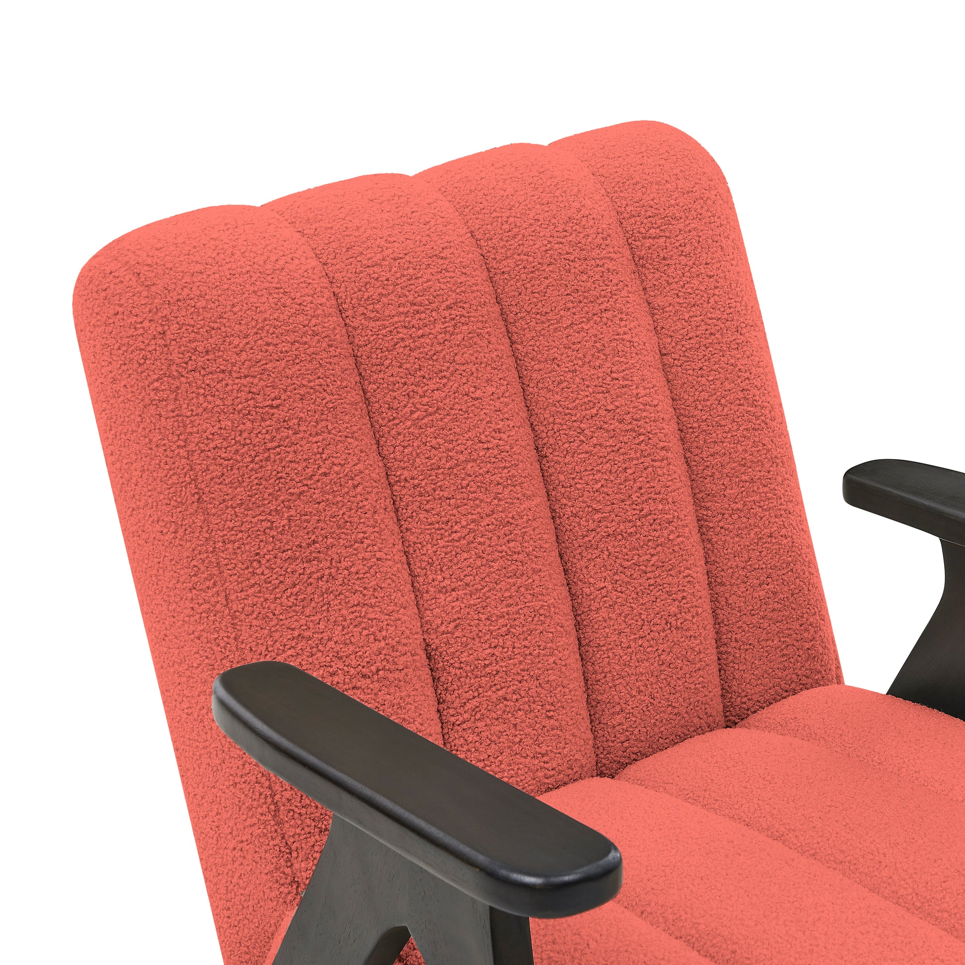 Coral textured upholstery armchair with dark wooden arms and channel tufting