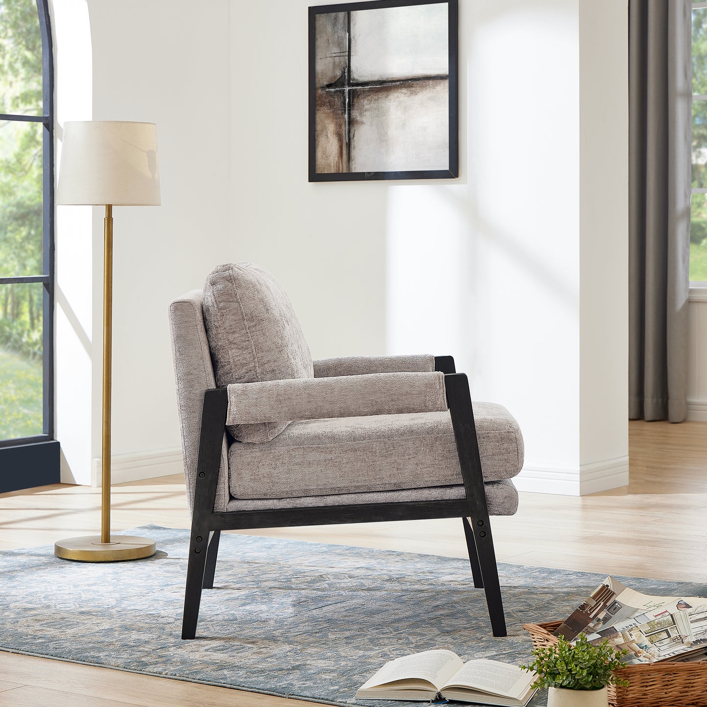 Upholstered accent chair with grey fabric and dark wood frame