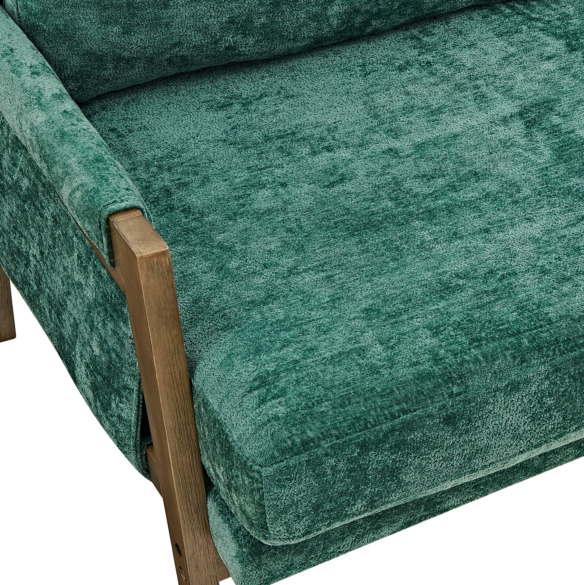 Deep teal plush velvet armchair with a natural wood frame
