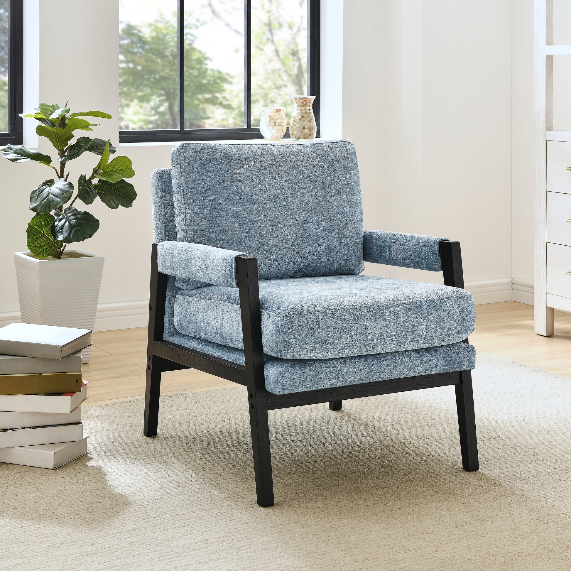 Modern blue upholstered accent chair with dark wood frame plush cushions and comfortable armrests