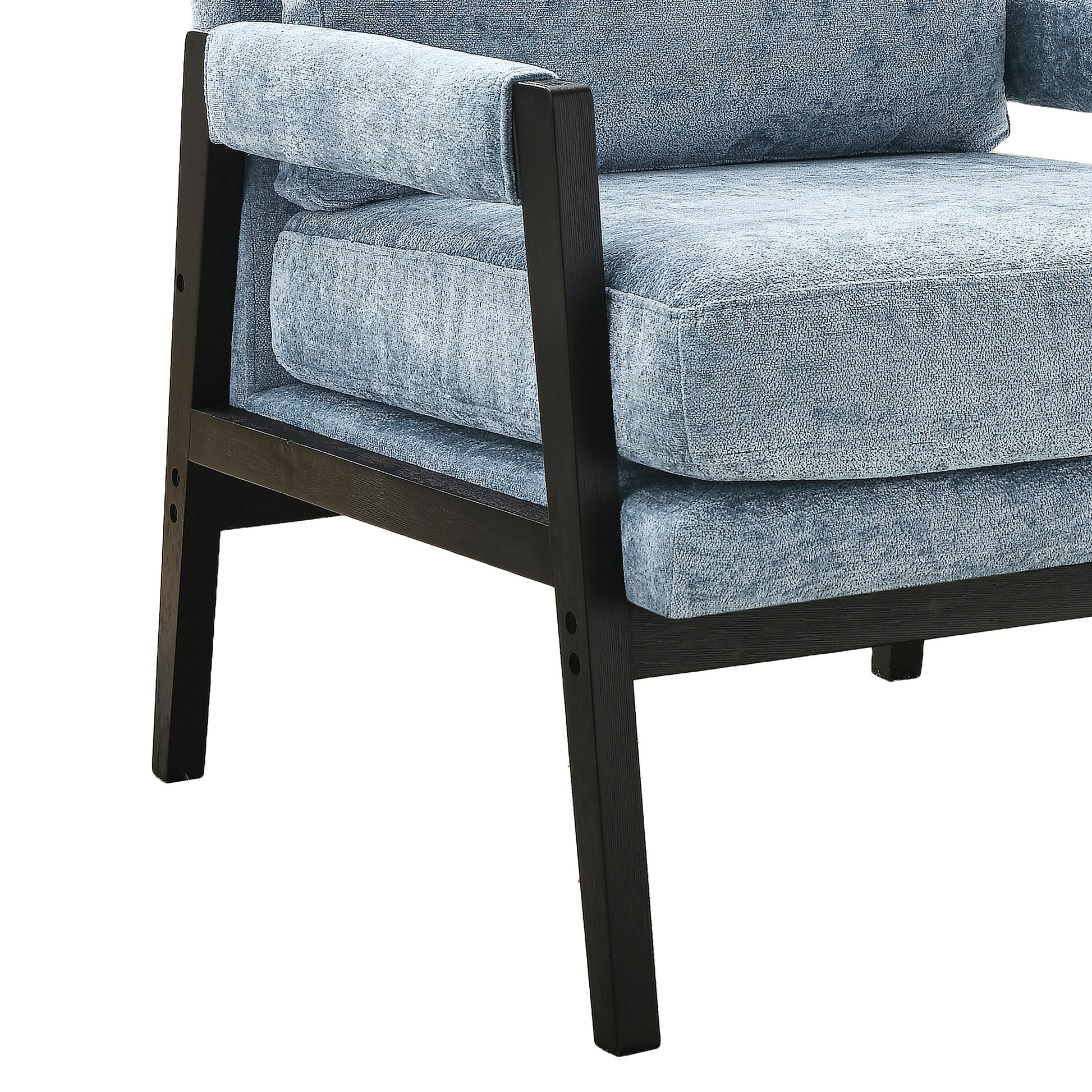 Closeup of a light blue textured armchair with dark wood frame and armrests offering a comfortable seat