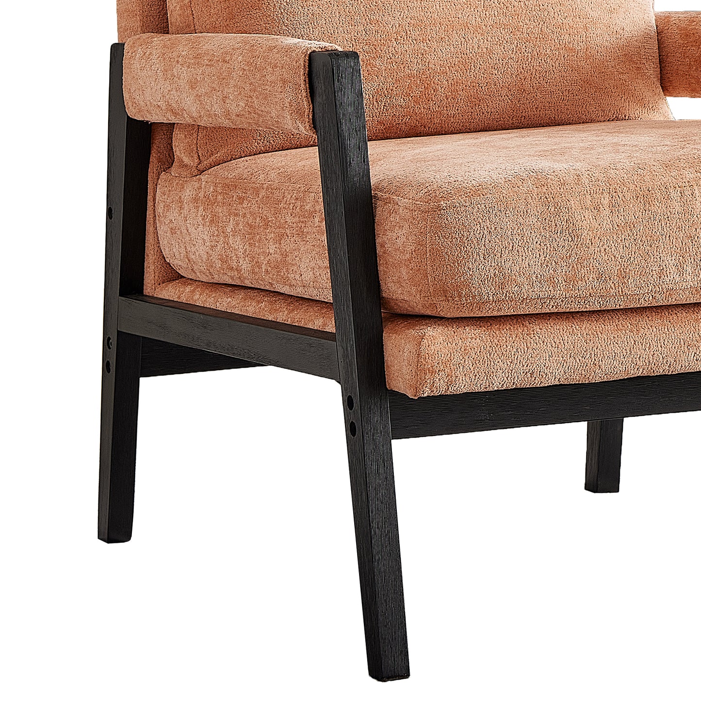 Close up of a modern accent chair with coral textured upholstery and dark wood frame