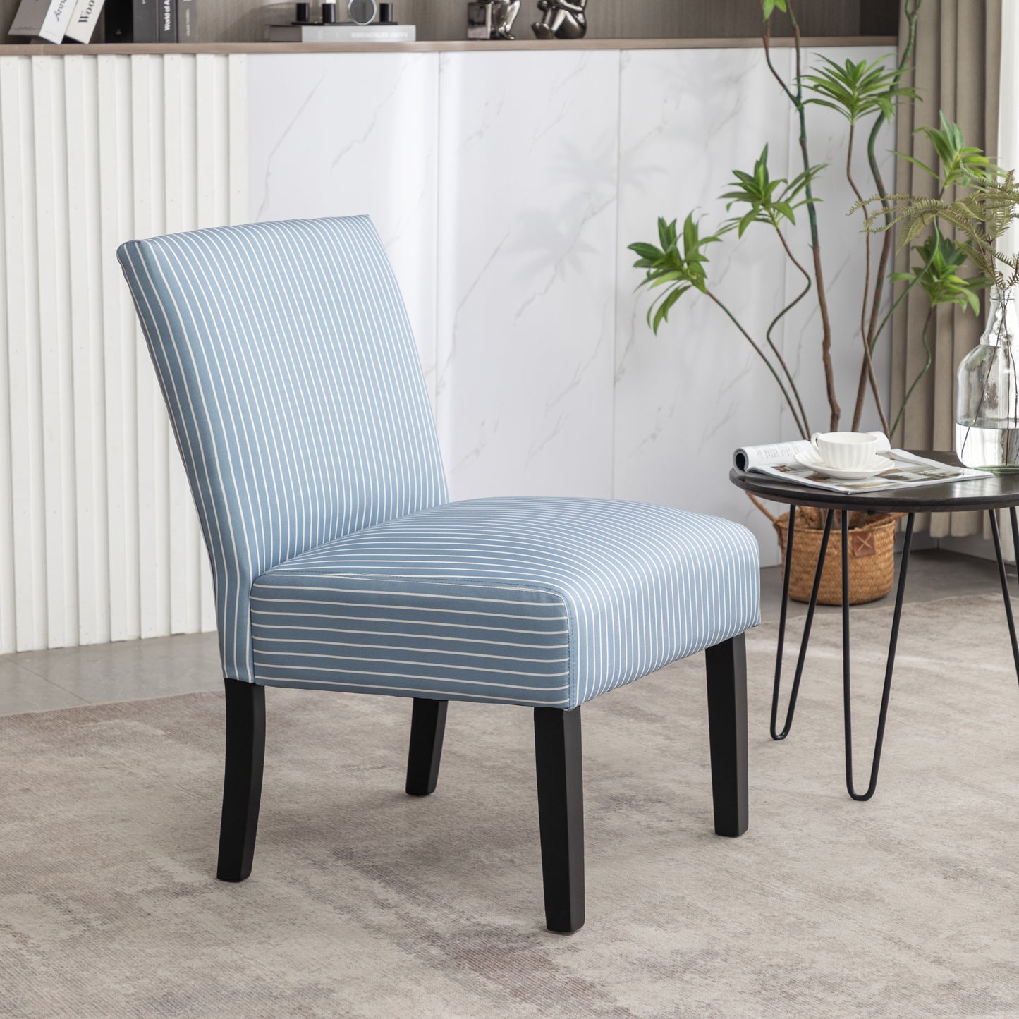 Blue and white striped accent chair with black legs perfect for living rooms