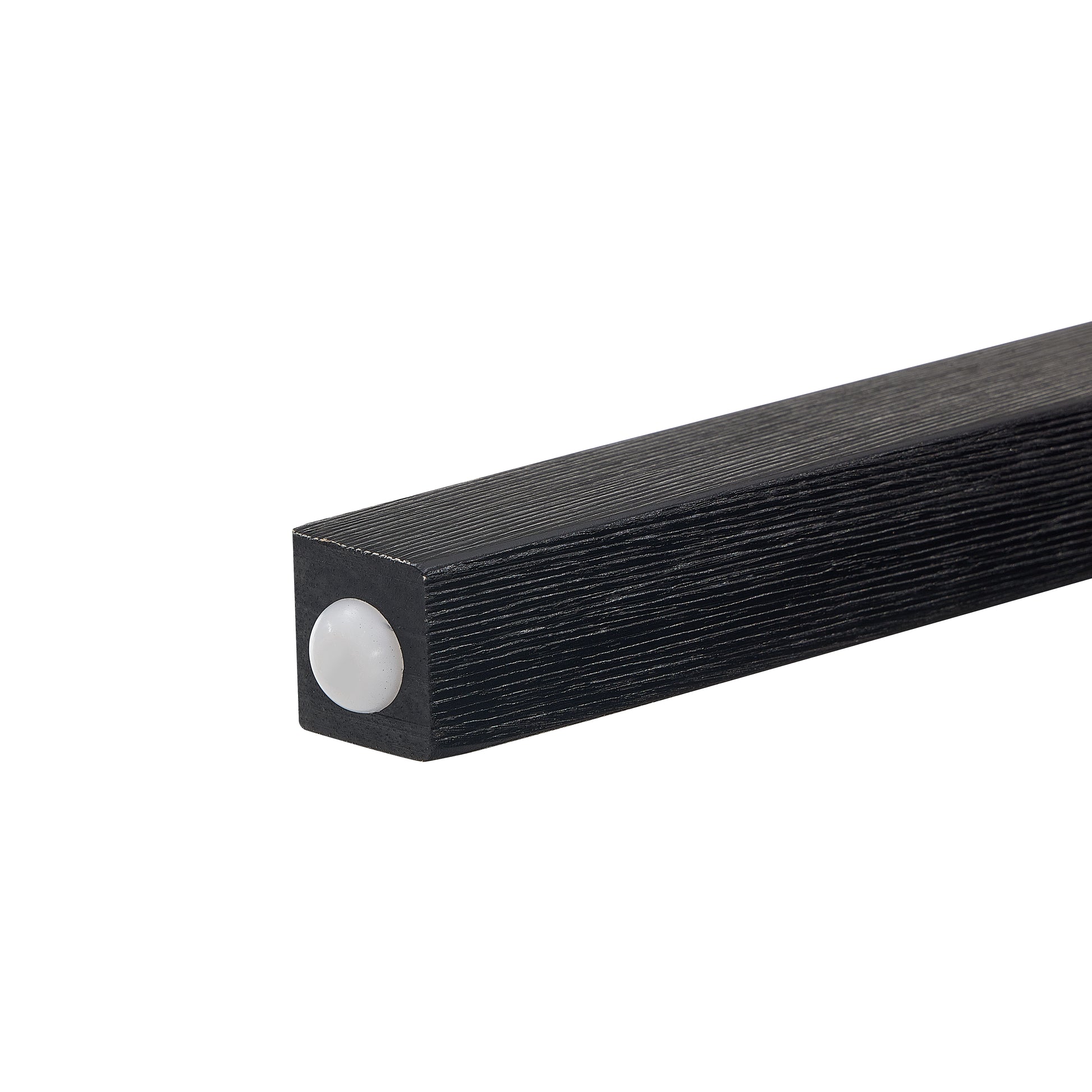Textured black wooden table leg with white foot pad