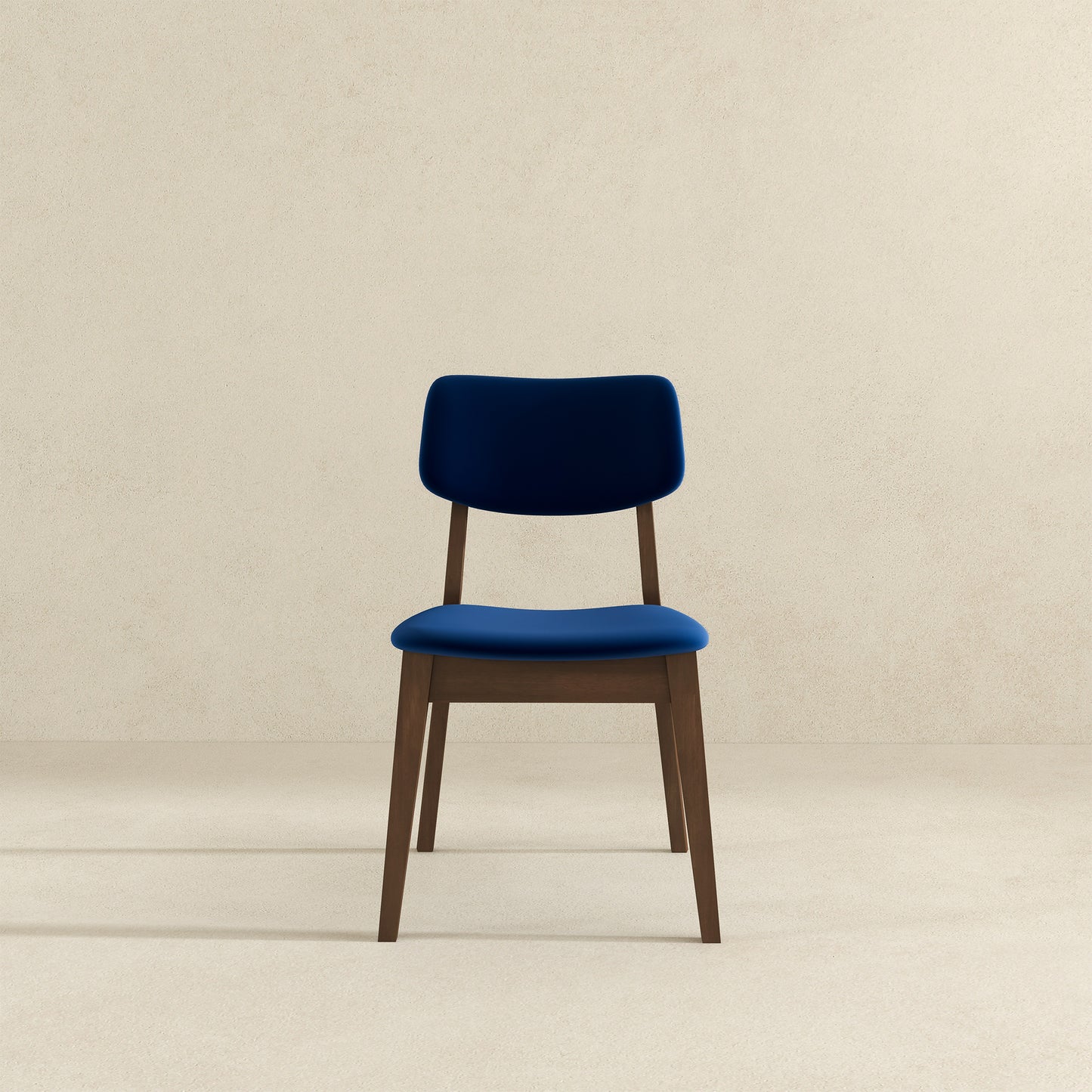 Deep blue velvet dining chair with a dark wood frame perfect for a modern kitchen