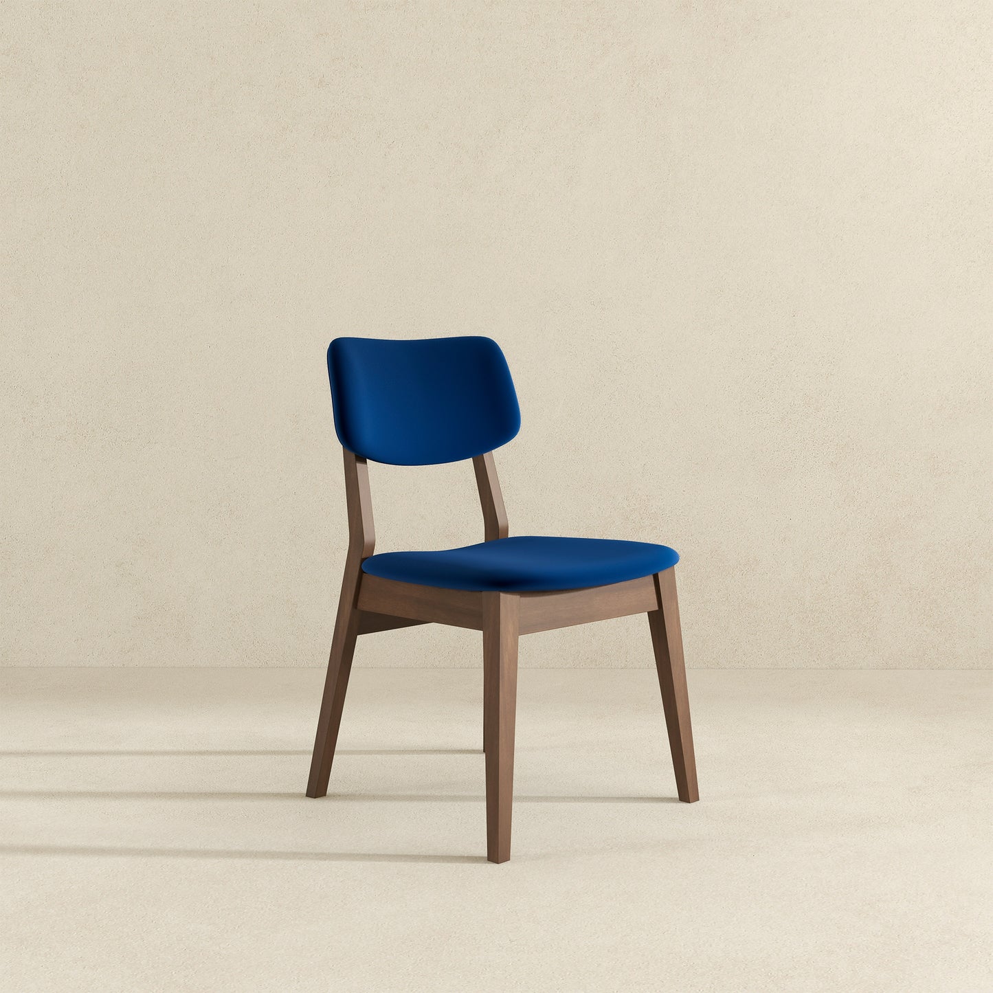 Navy blue upholstered dining chair with a modern wooden frame