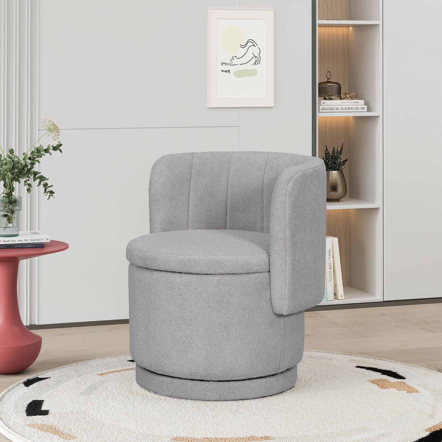 Plush grey swivel accent chair with vertical channel tufting and a round base