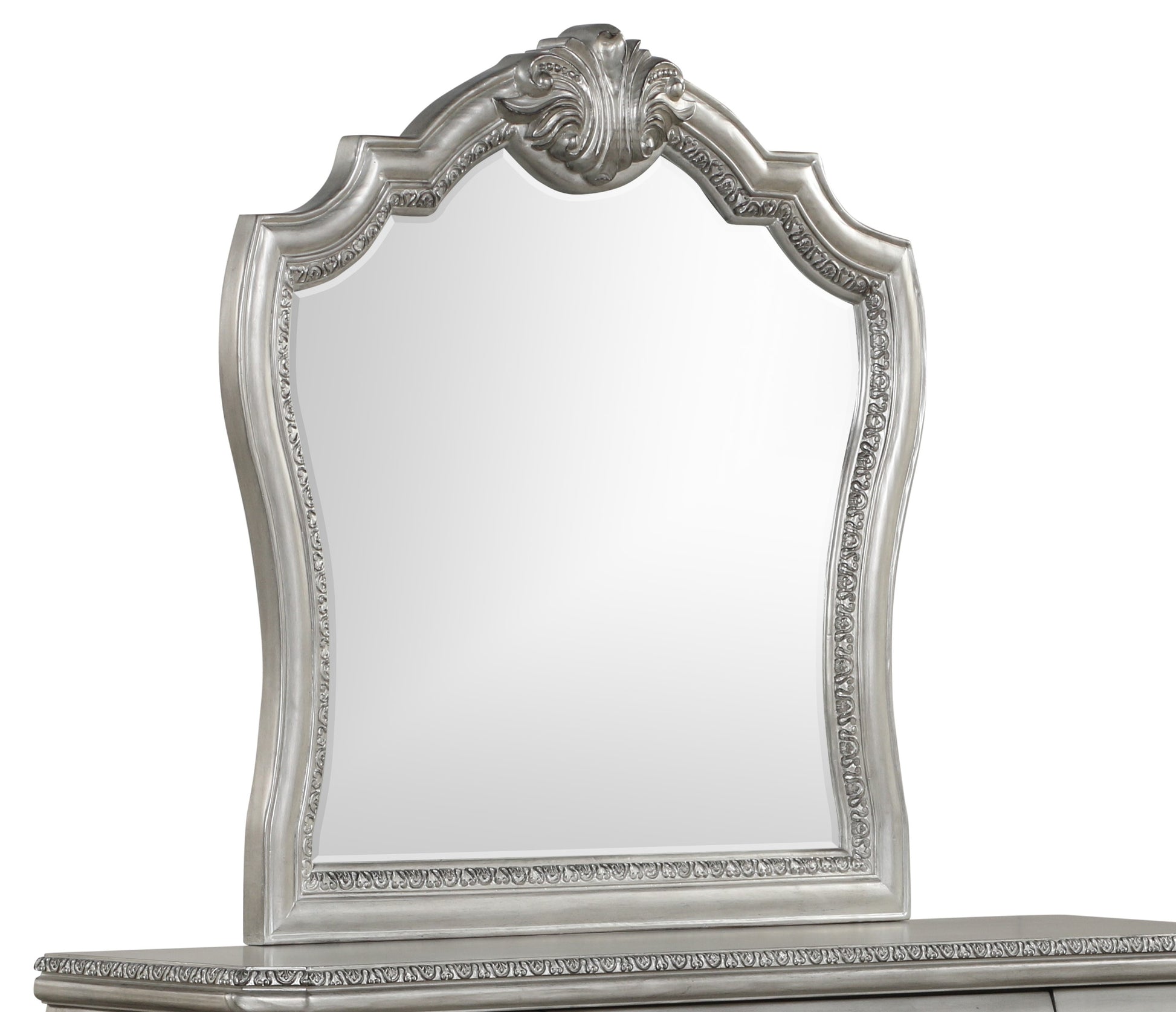 Ornate silver dresser mirror with carved detailing and a large reflective surface