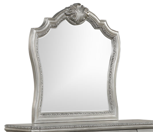 Ornate silver dresser mirror with carved detailing and a large reflective surface
