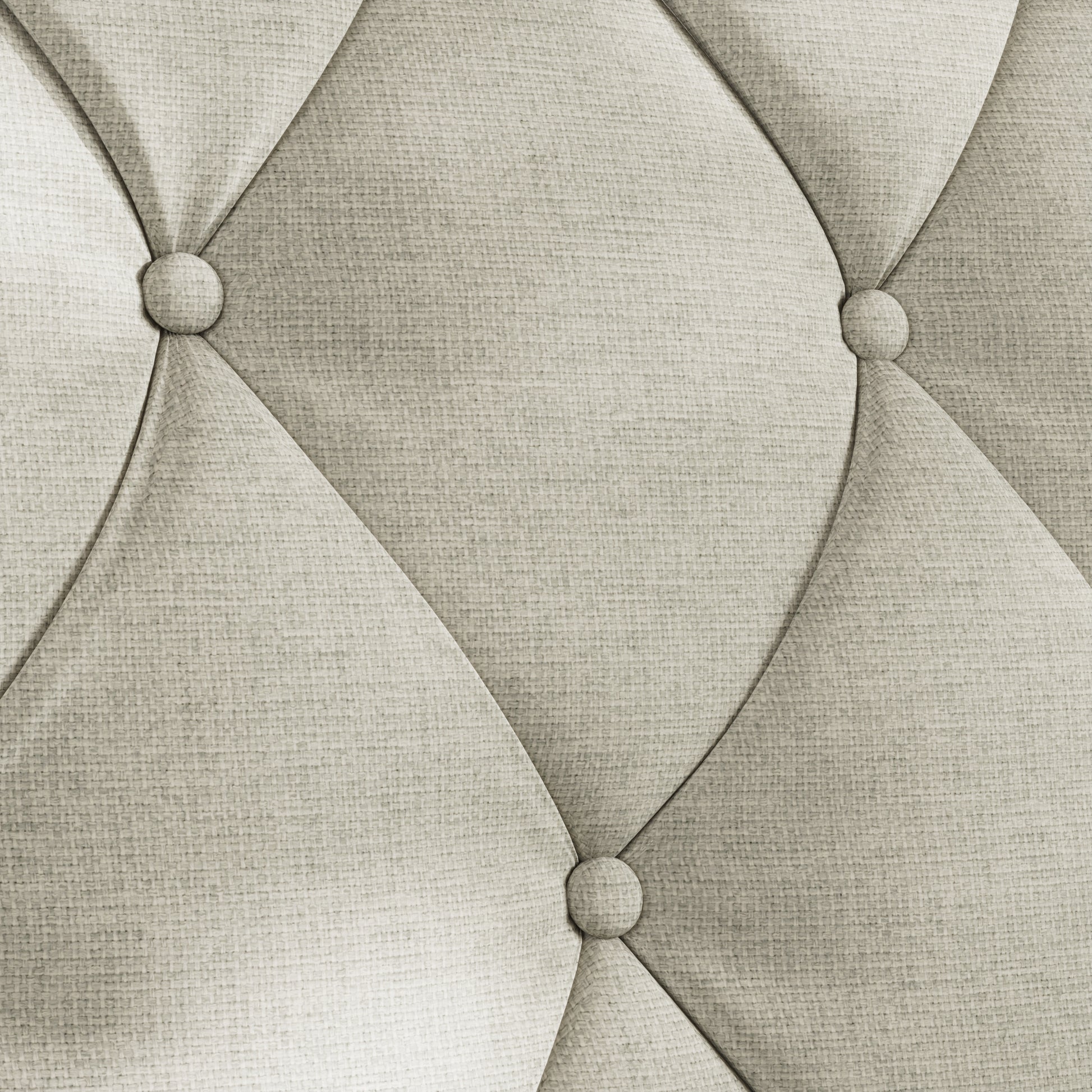 Closeup of light beige linen fabric with diamond tufting and button details