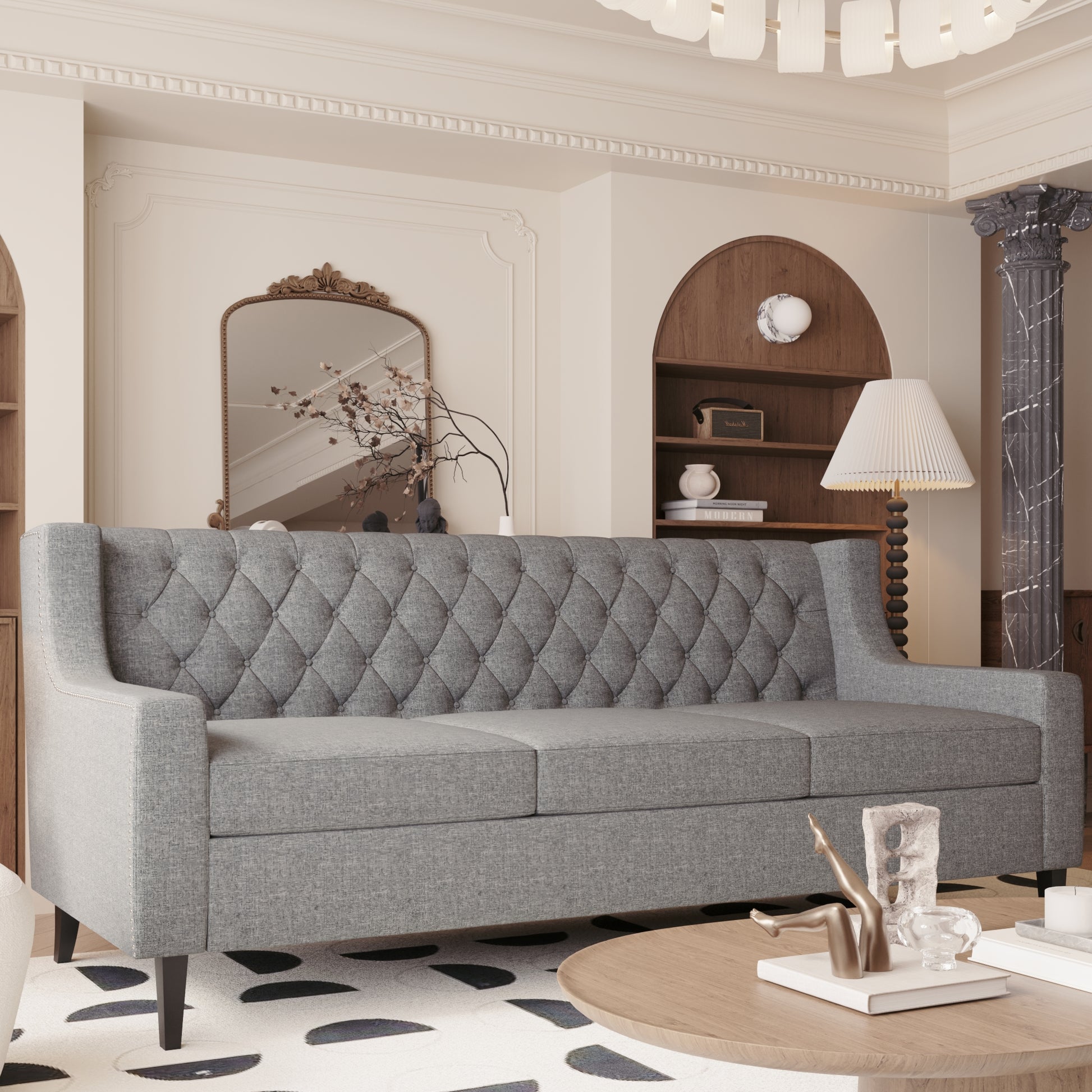 Grey fabric tufted sofa with nailhead trim perfect for living room