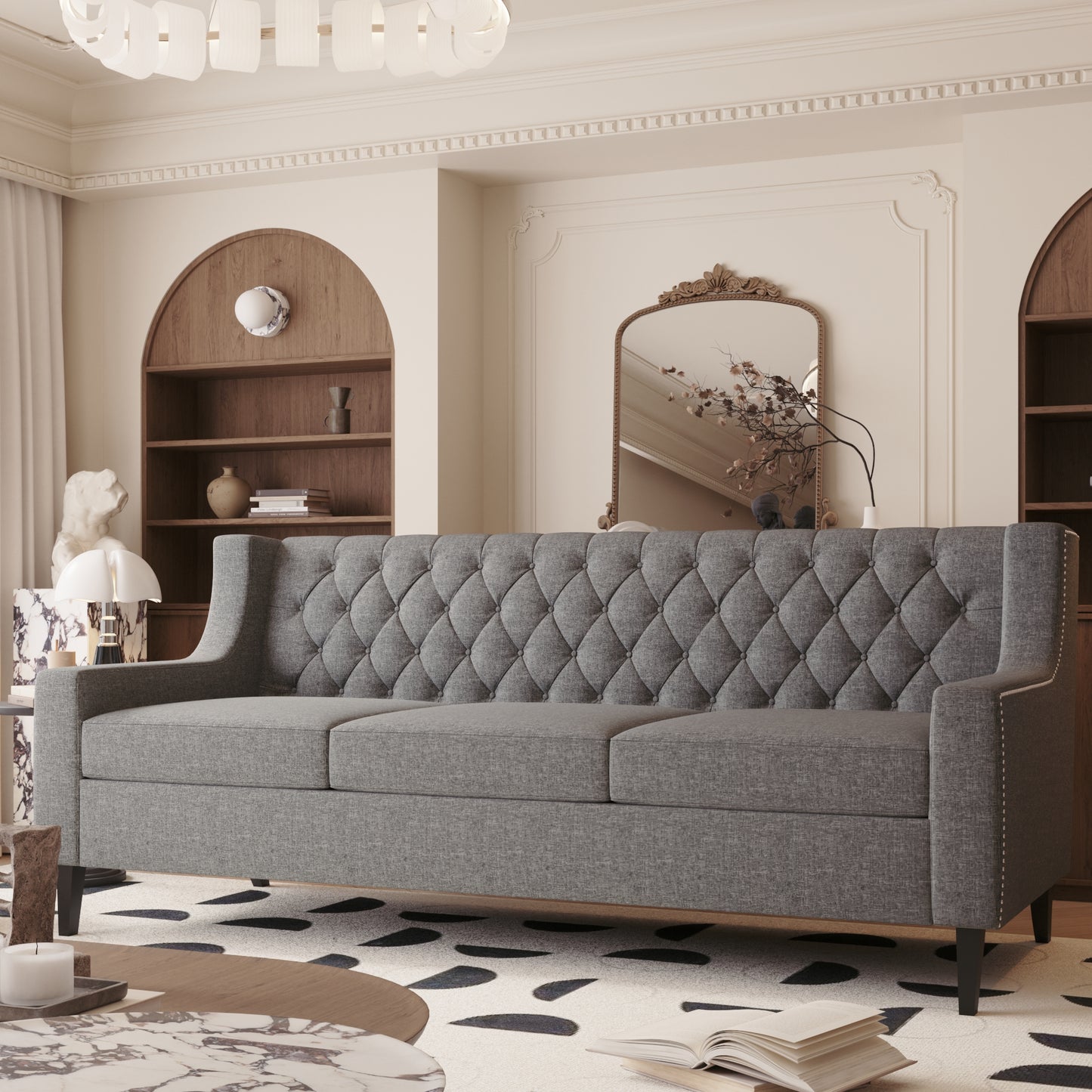 Grey tufted sofa with nailhead trim offering a classic design for living rooms