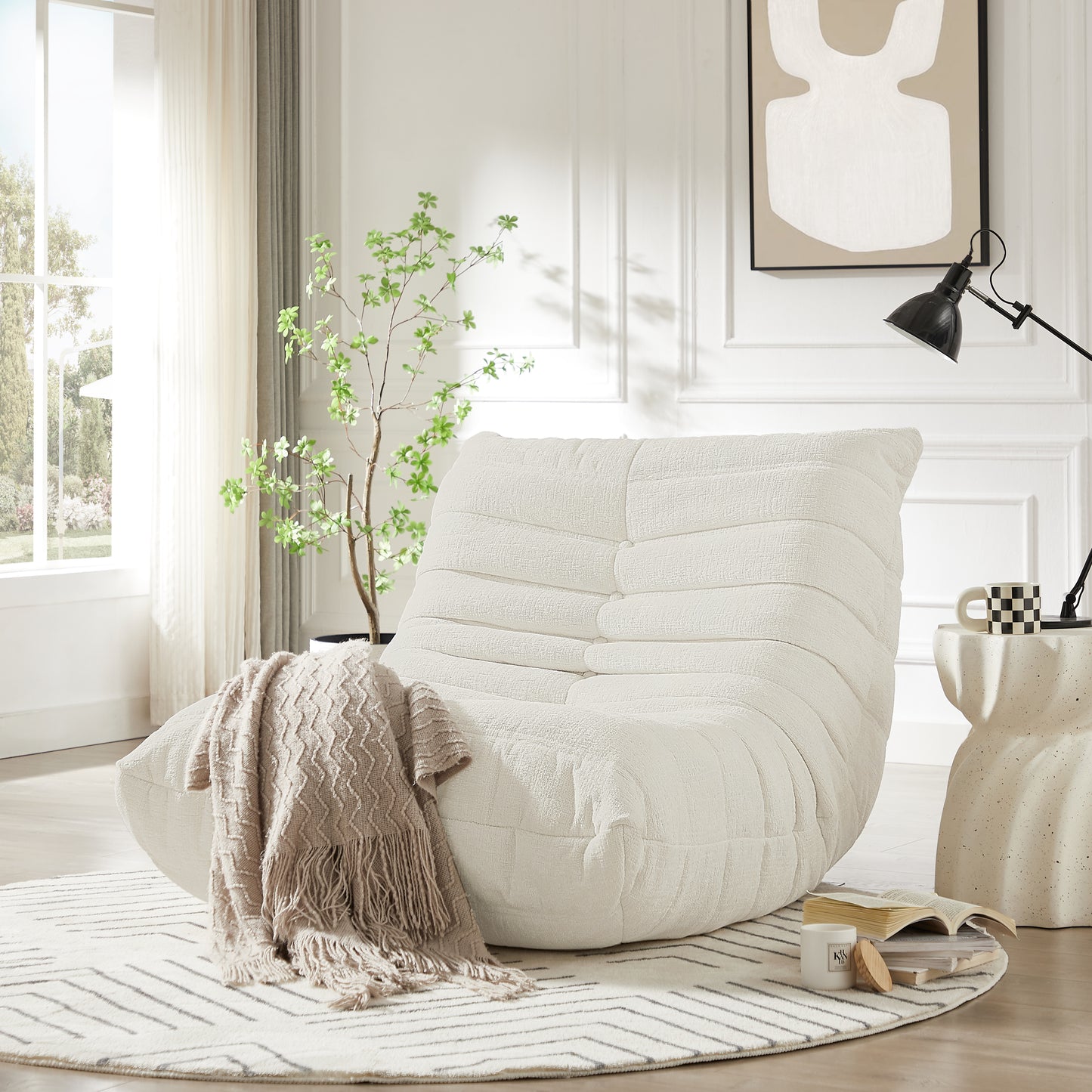 Cream boucle fabric accent chair with a textured tufted design for a cozy living room