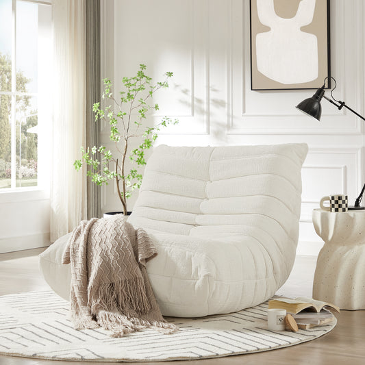 Cream boucle fabric accent chair with a textured tufted design for a cozy living room