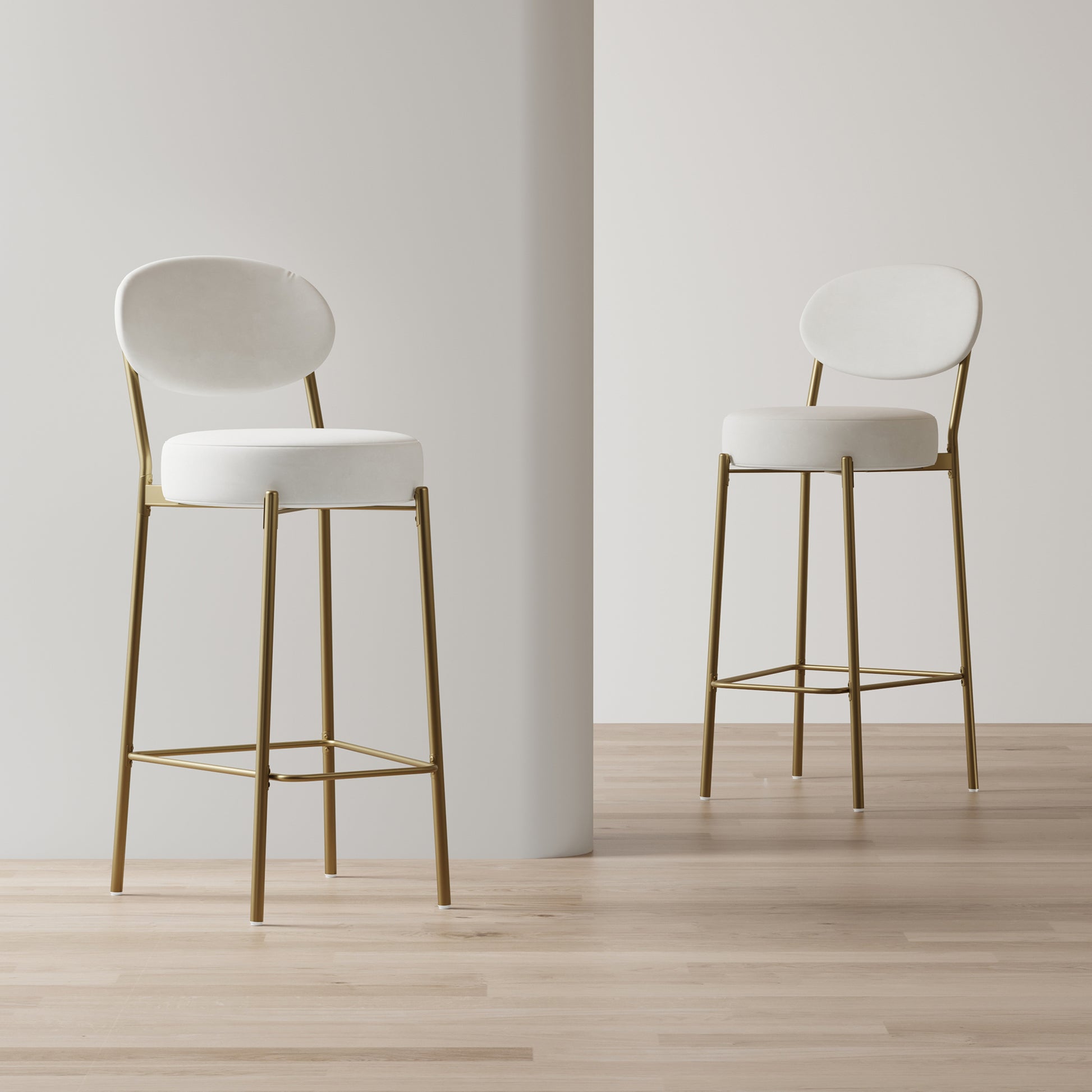 Cream velvet bar stool with brushed gold metal legs and round seat
